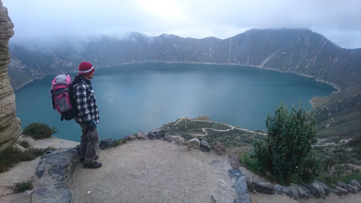 Quilotoa crater lake filled with turquoise-green water in the Ecuadorian Andes