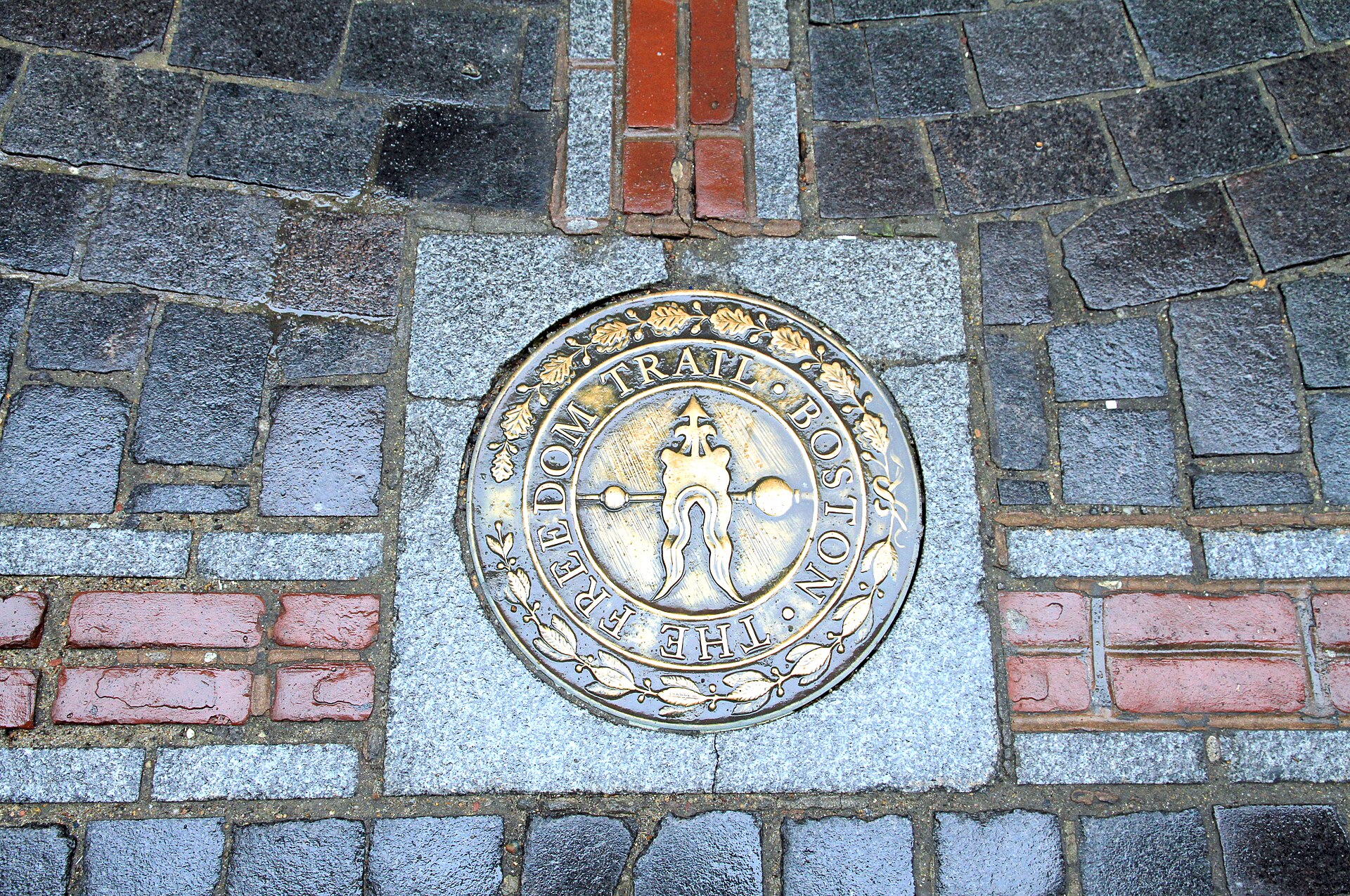 The Freedom Trail in Boston marked with red brick pathway connecting historic sites
