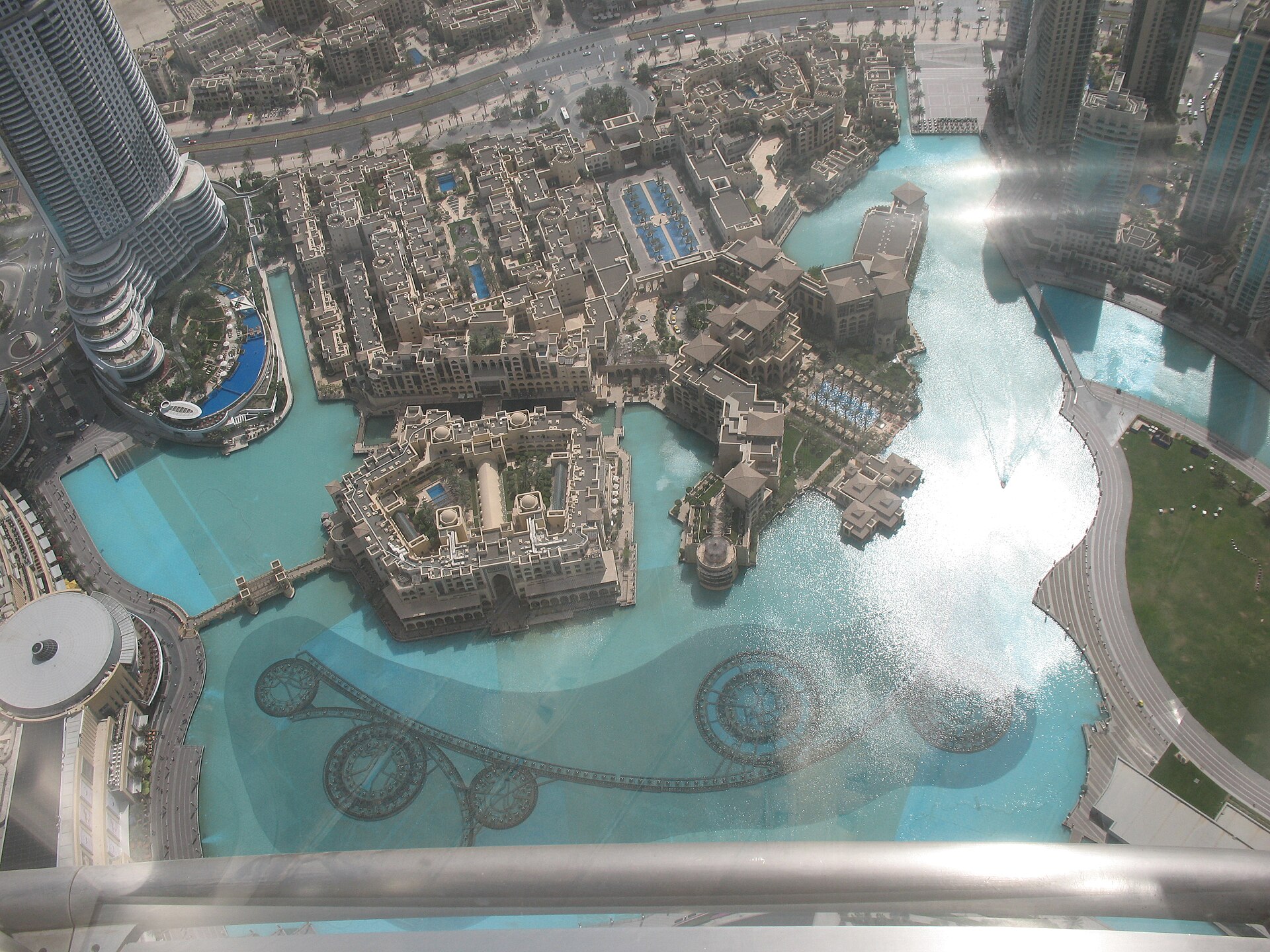 Aerial view of the Dubai Fountain and surrounding skyline from the top of Burj Khalifa