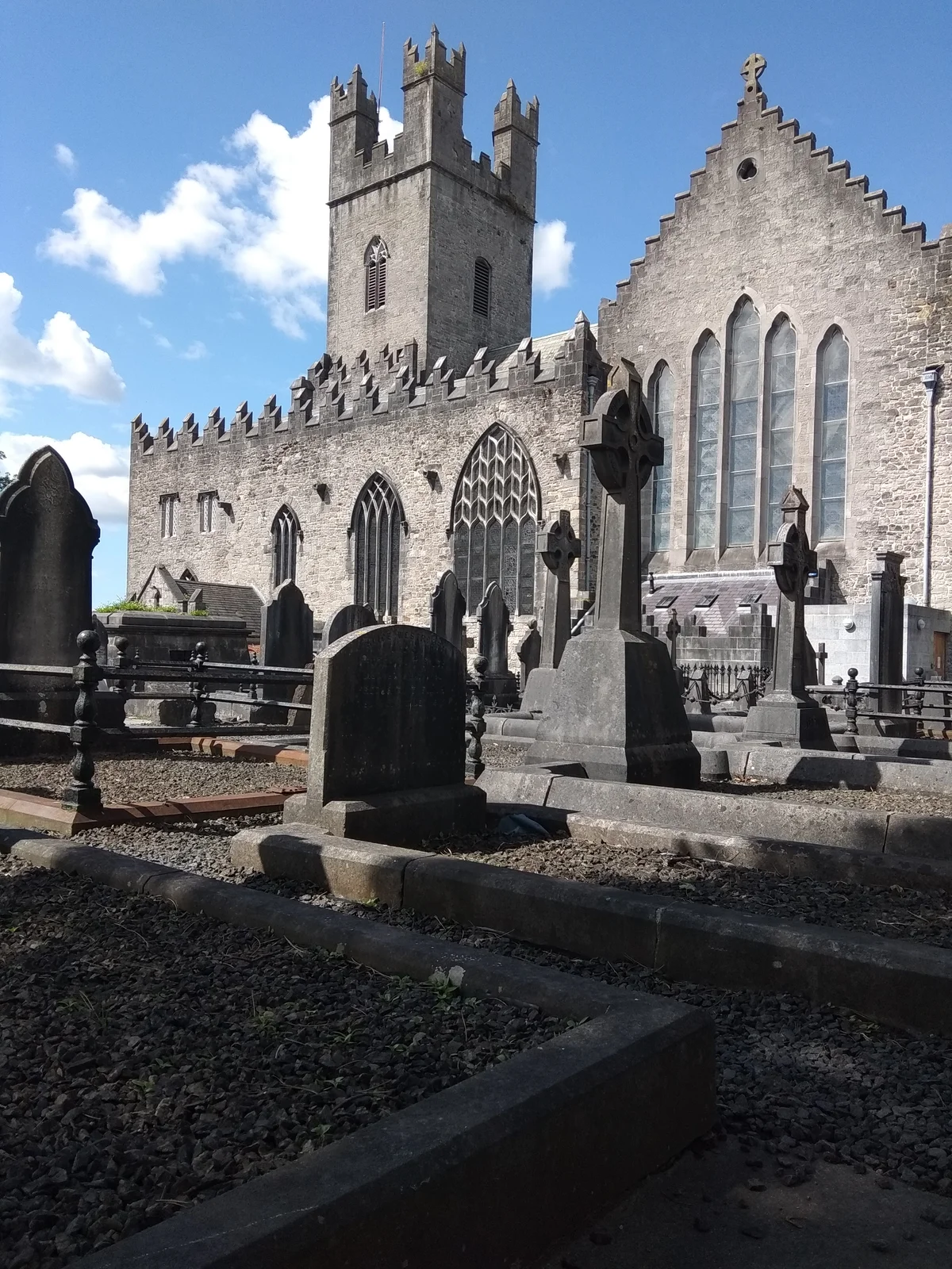 The medieval tower and limestone facade of St Mary's Cathedral in Limerick