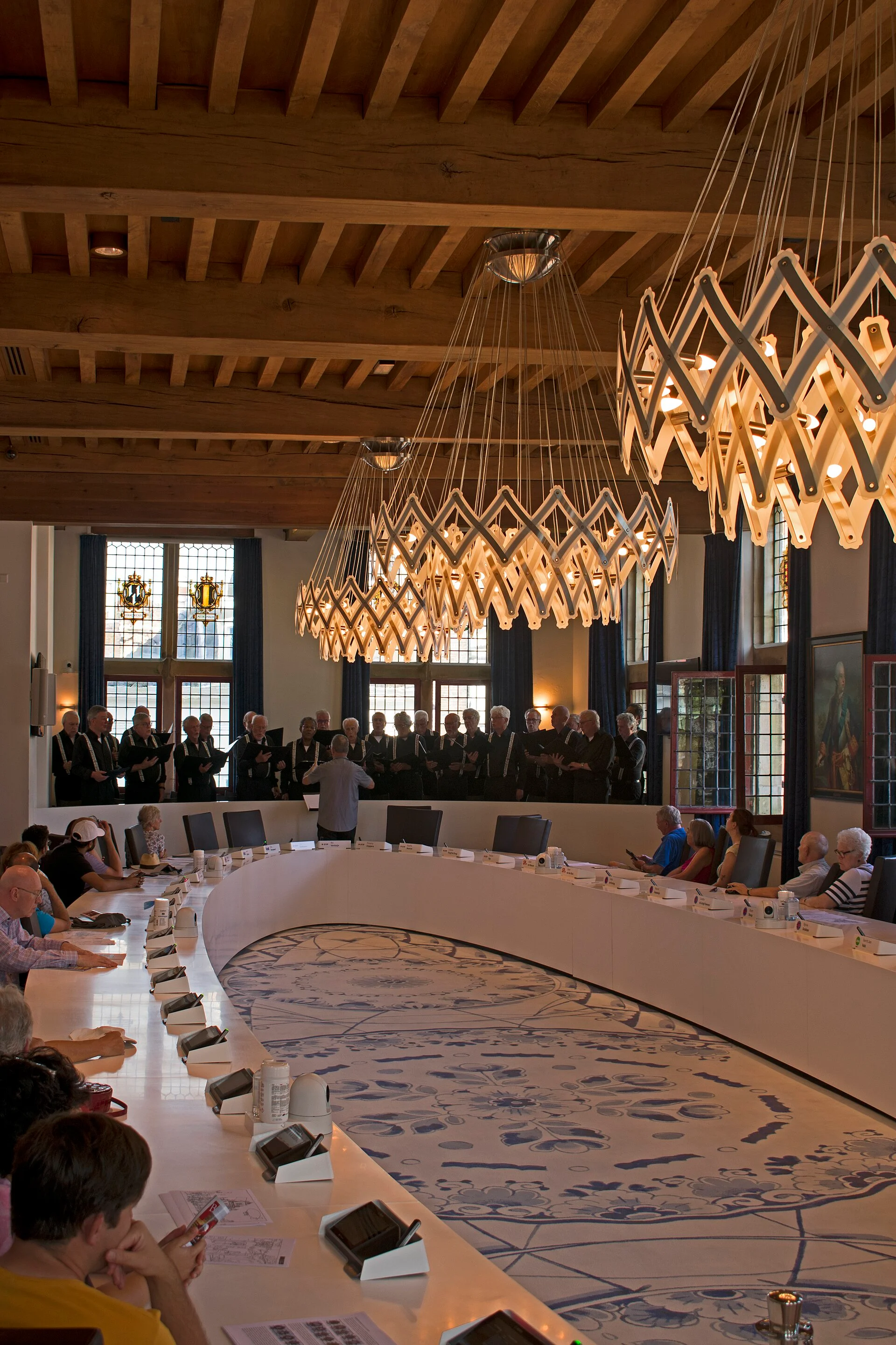 Beamed council chamber inside Delft City Hall with a Delft-blue floor