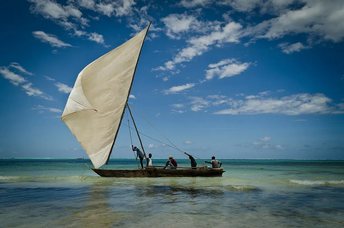 Traditional dhow sailing in the turquoise waters off Zanzibar island