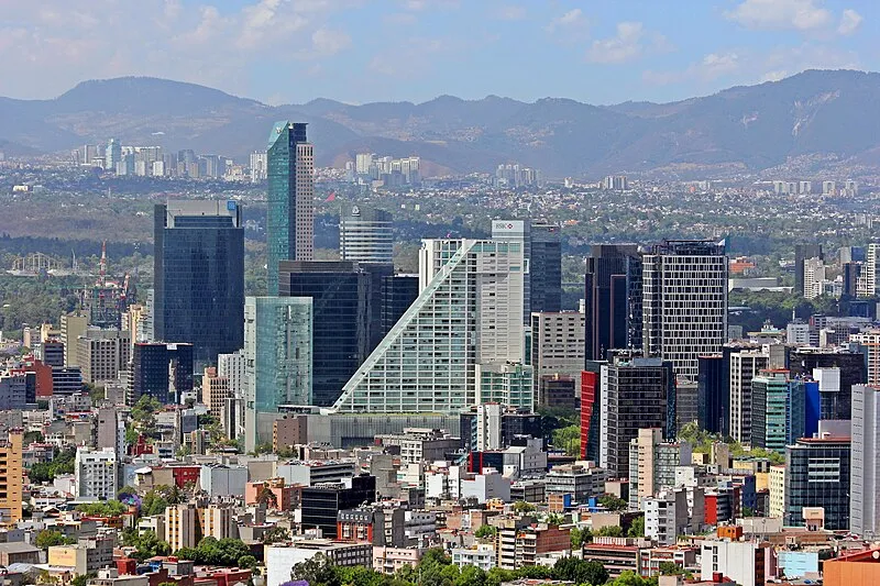 Mexico City skyline along Paseo de la Reforma with the Angel of Independence monument
