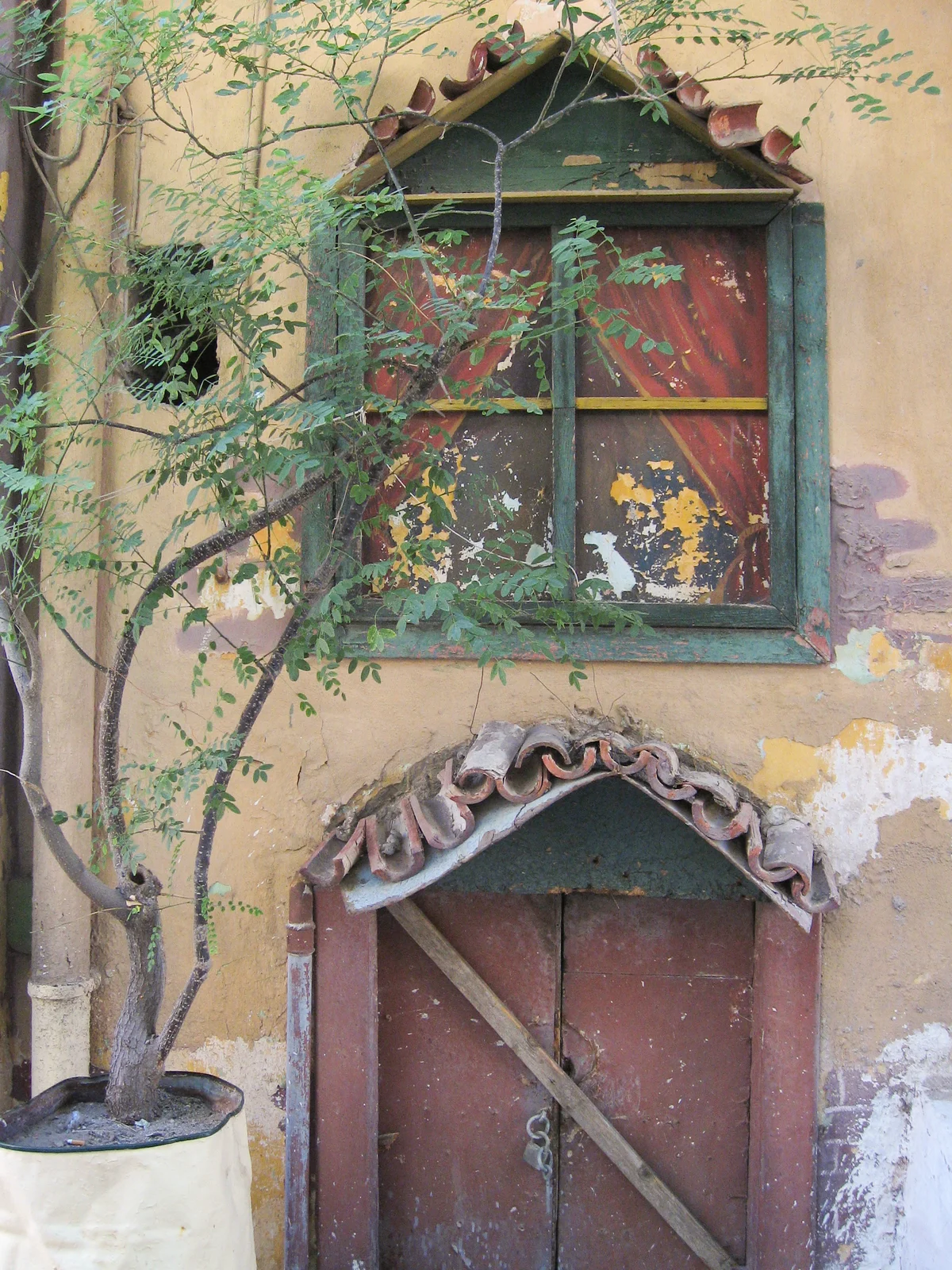 Ornate old doorway with decorative detailing in Plaka, Athens