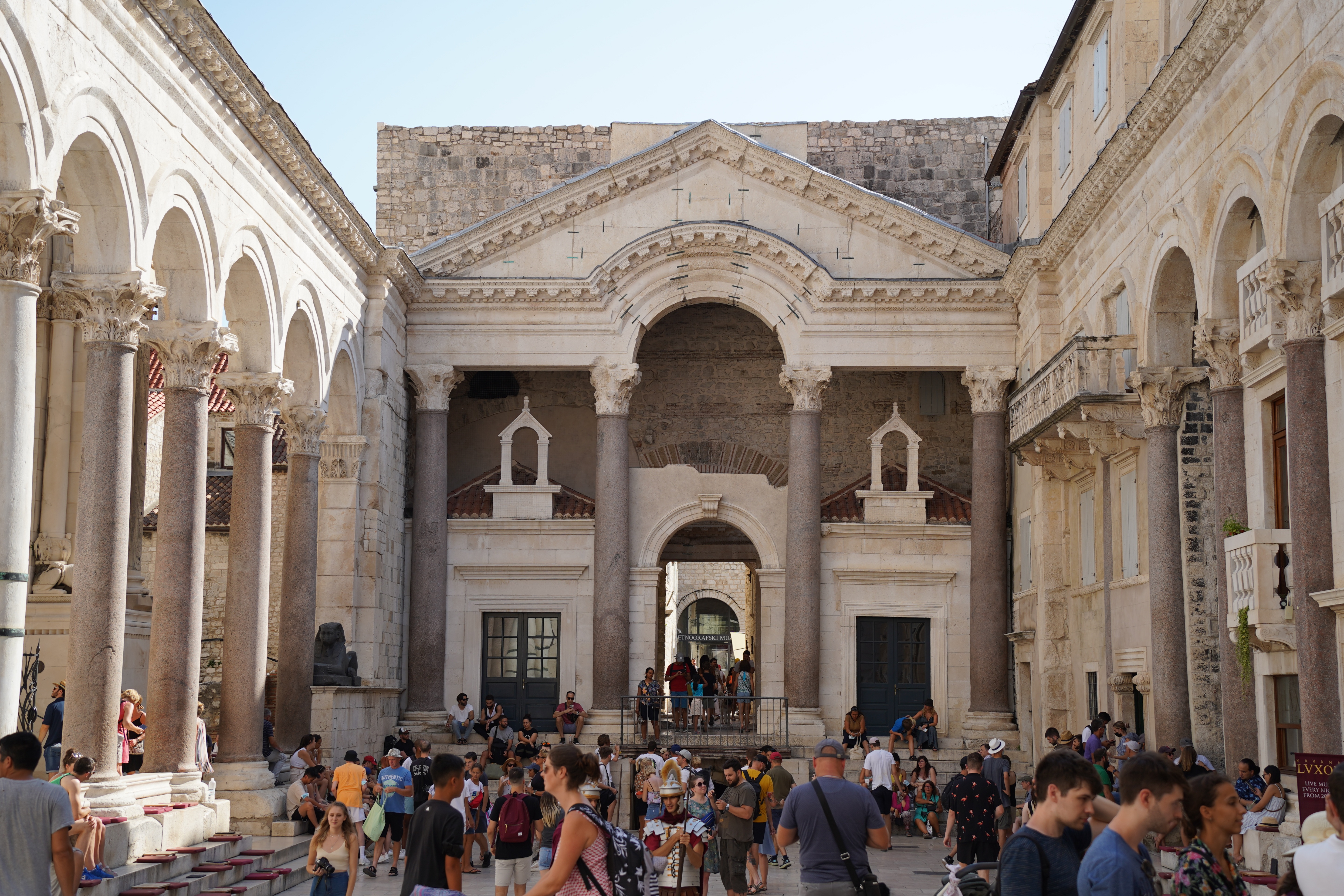 The Peristyle of Diocletian's Palace in Split, Croatia, where Roman columns frame a café terrace Sunset over the Peristyle square inside Diocletian's Palace, where 1,700 years of continuous habitation have layered Roman columns beneath Croatian cafes and homes