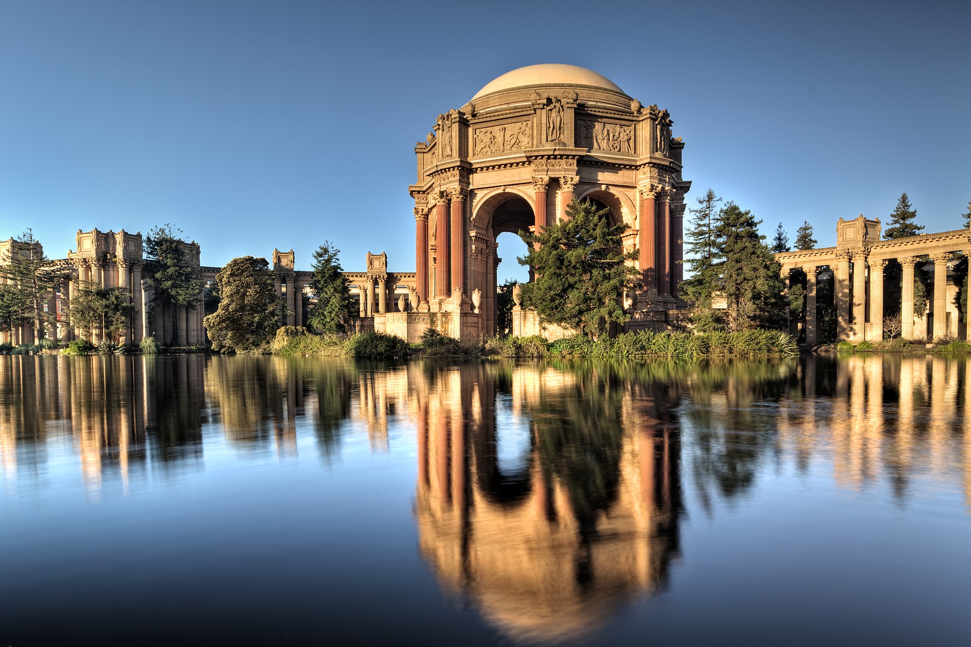 The Palace of Fine Arts in San Francisco with its Roman rotunda reflected in the lagoon