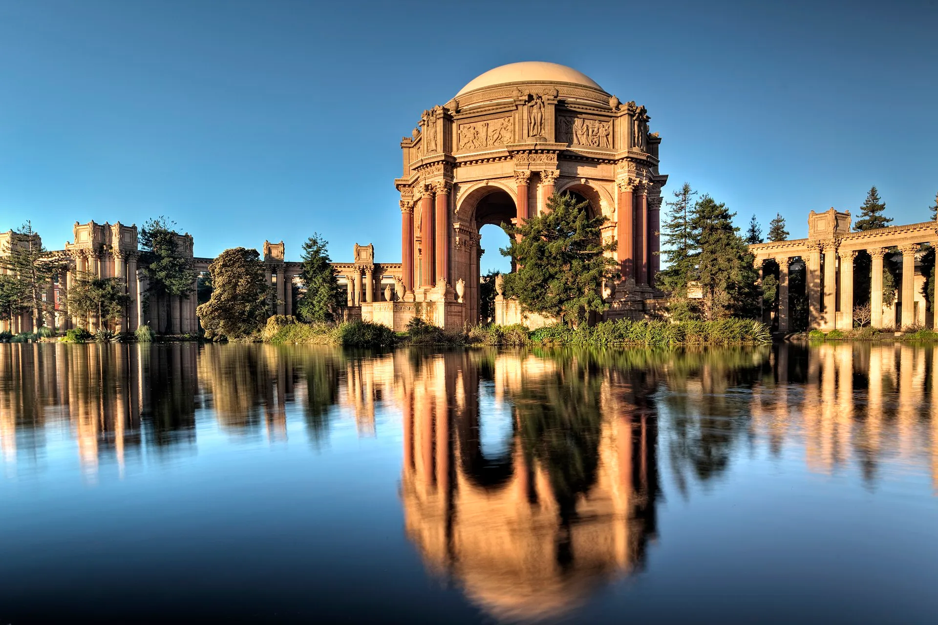 The Palace of Fine Arts in San Francisco with its Roman rotunda reflected in the lagoon