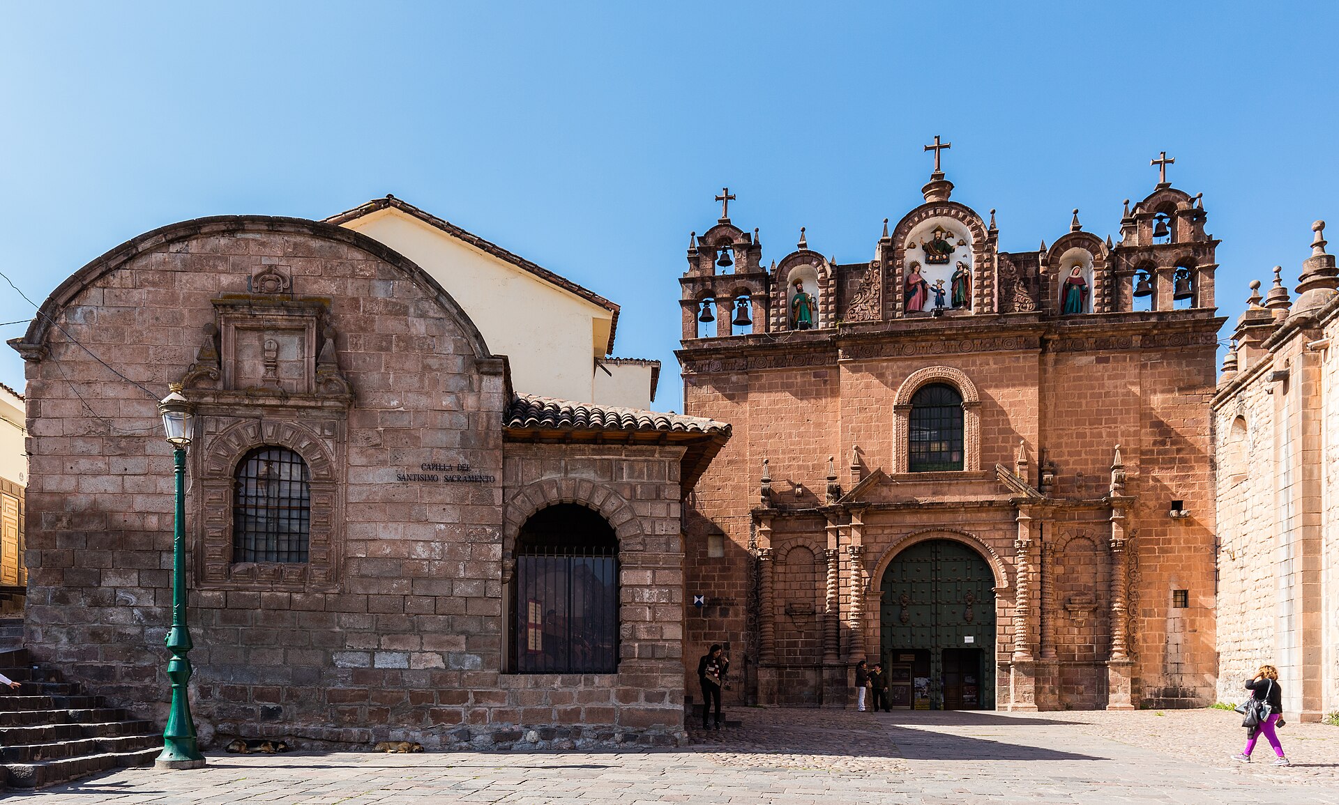 Cusco Cathedral and the Church of the Society of Jesus illuminated at dusk on the Plaza de Armas, Cusco, Peru