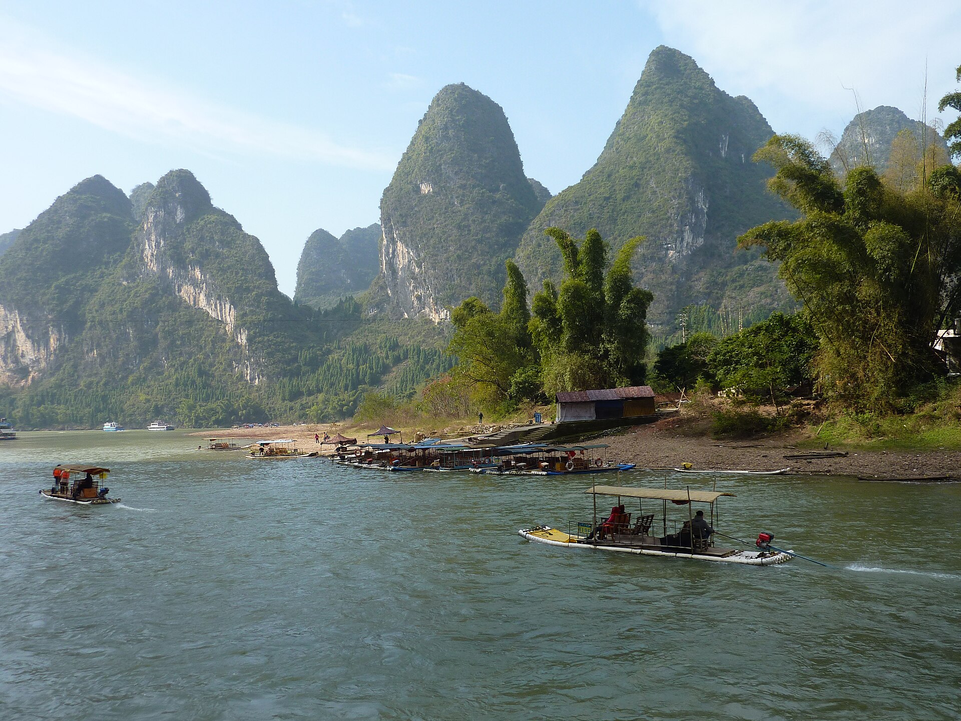 Cruise boat on the Li River with karst peaks in the background near Guilin