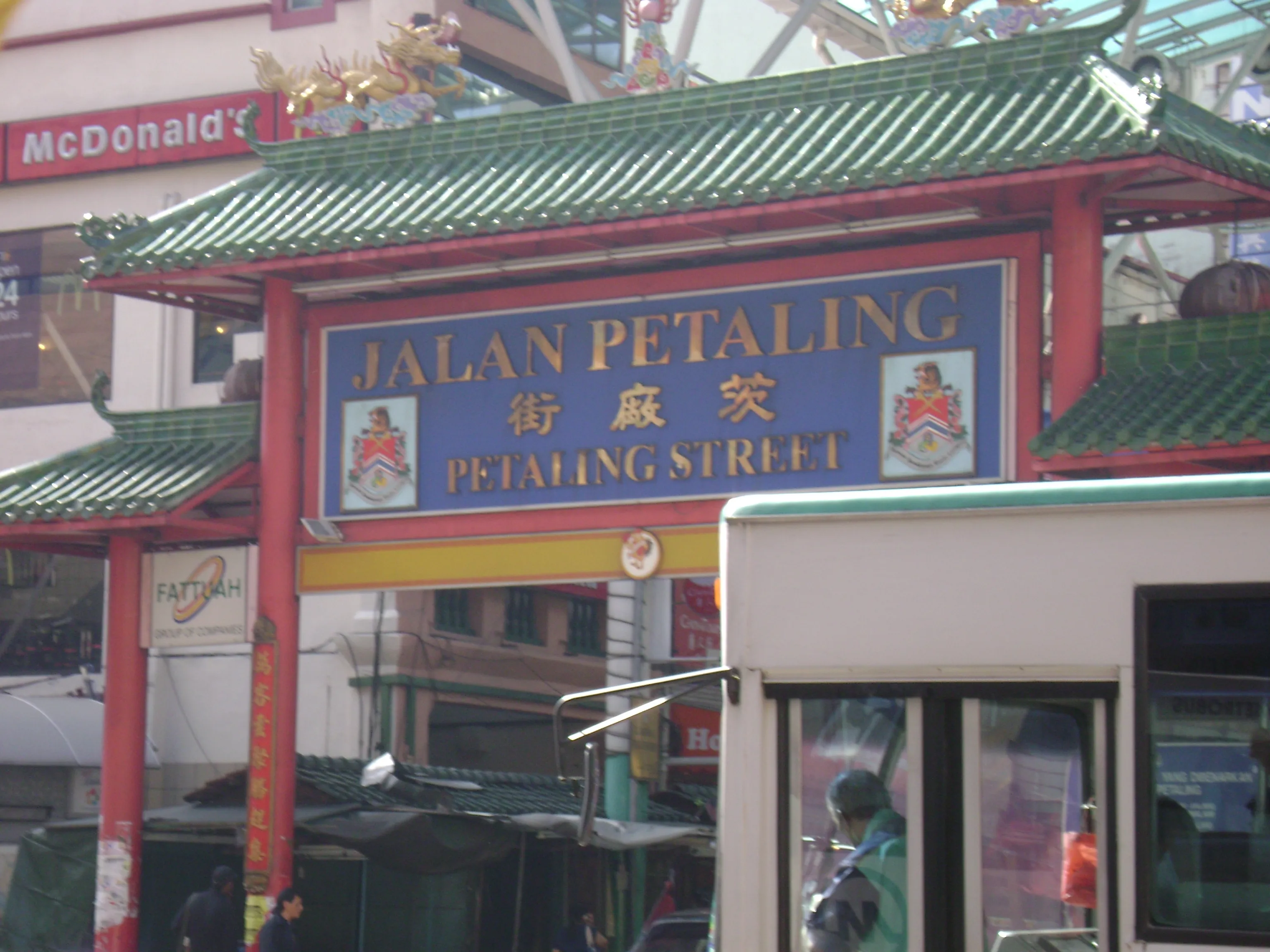 Petaling Street in Kuala Lumpur's Chinatown lit up at night with red lanterns and market stalls