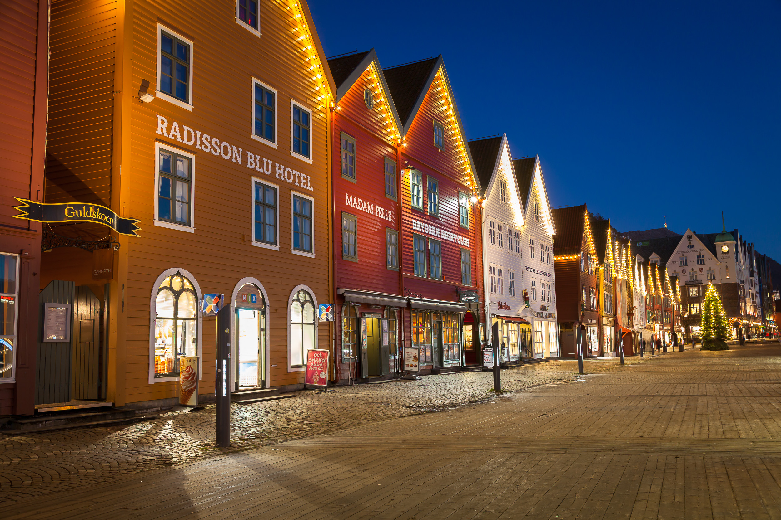 Bryggen Hanseatic wharf illuminated at night in Bergen, Norway