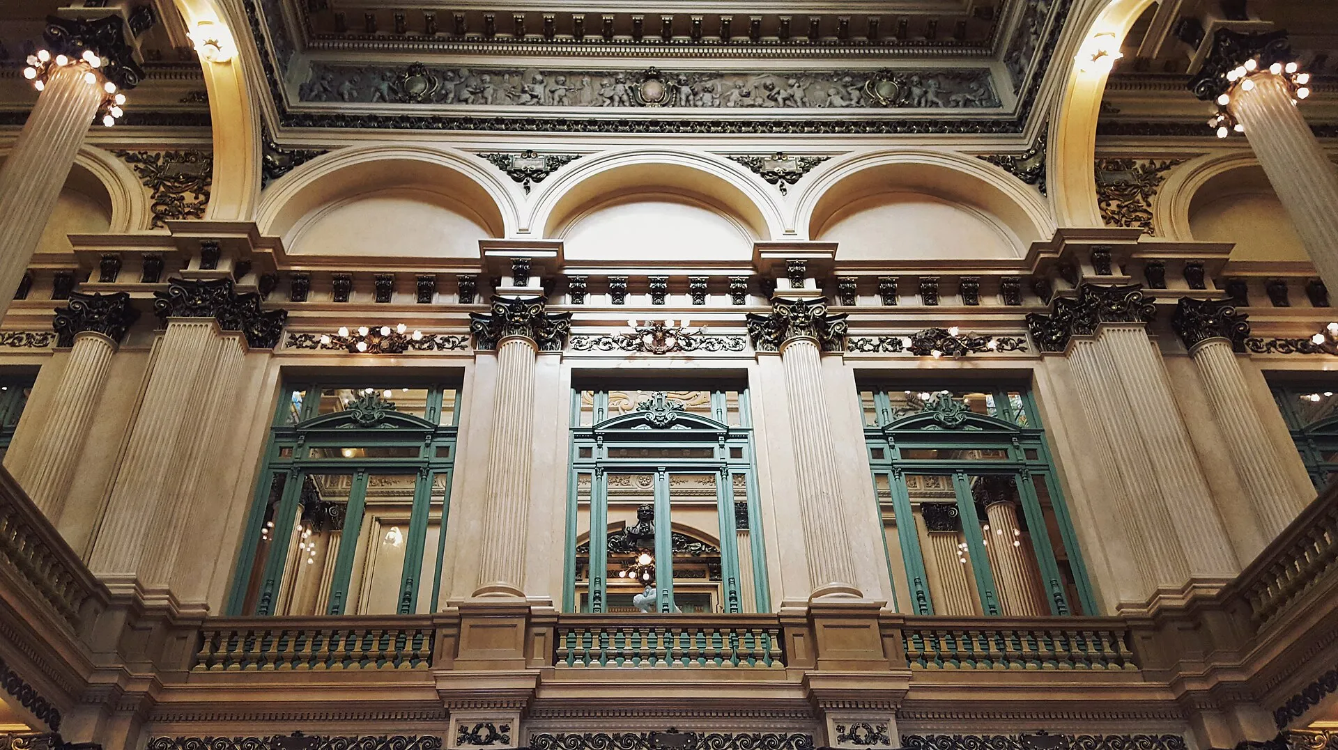 Marble-columned grand foyer and lobby of Teatro Colón