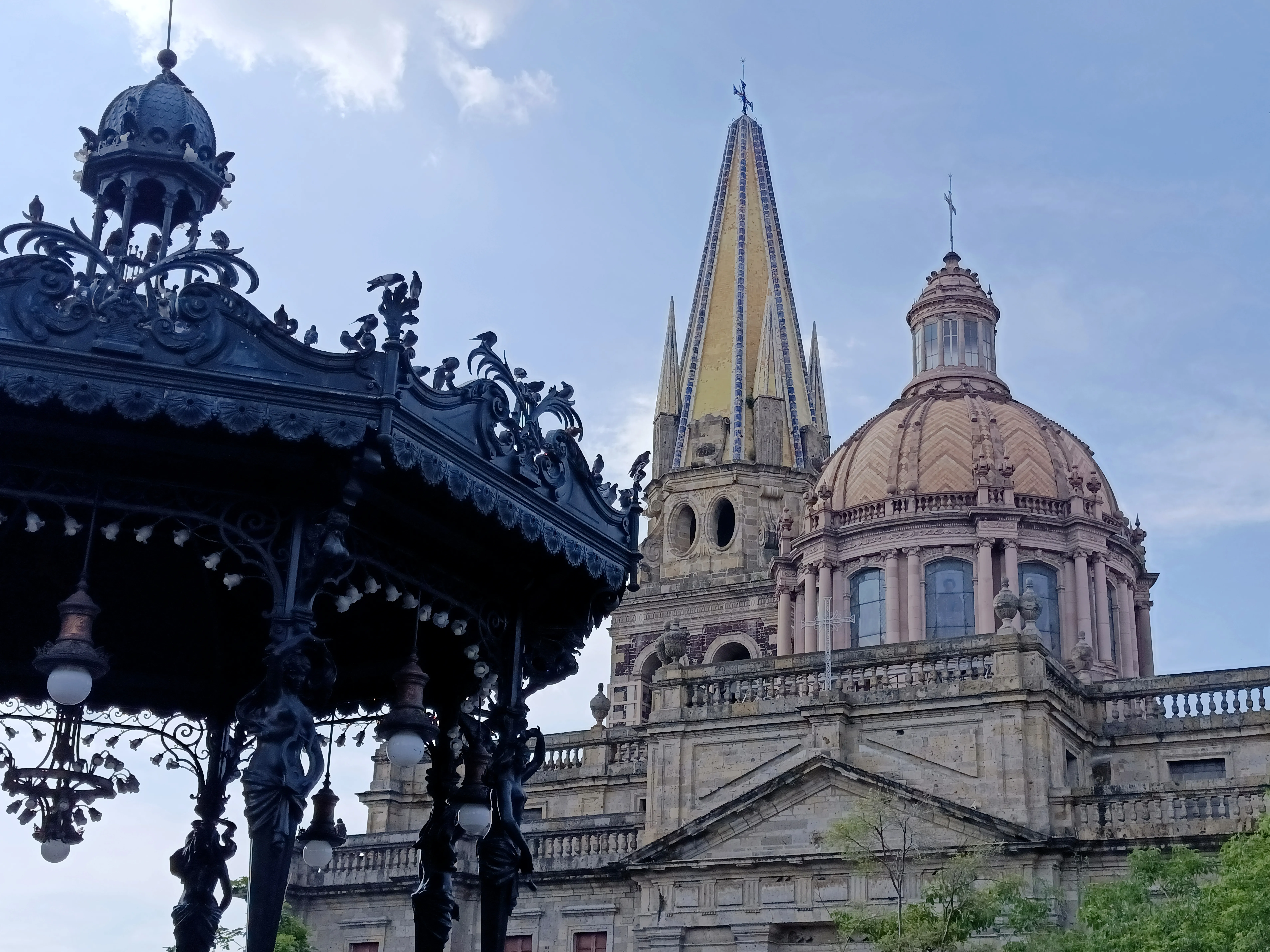 The yellow-tiled neo-Gothic twin towers of Guadalajara Cathedral rising above the historic center