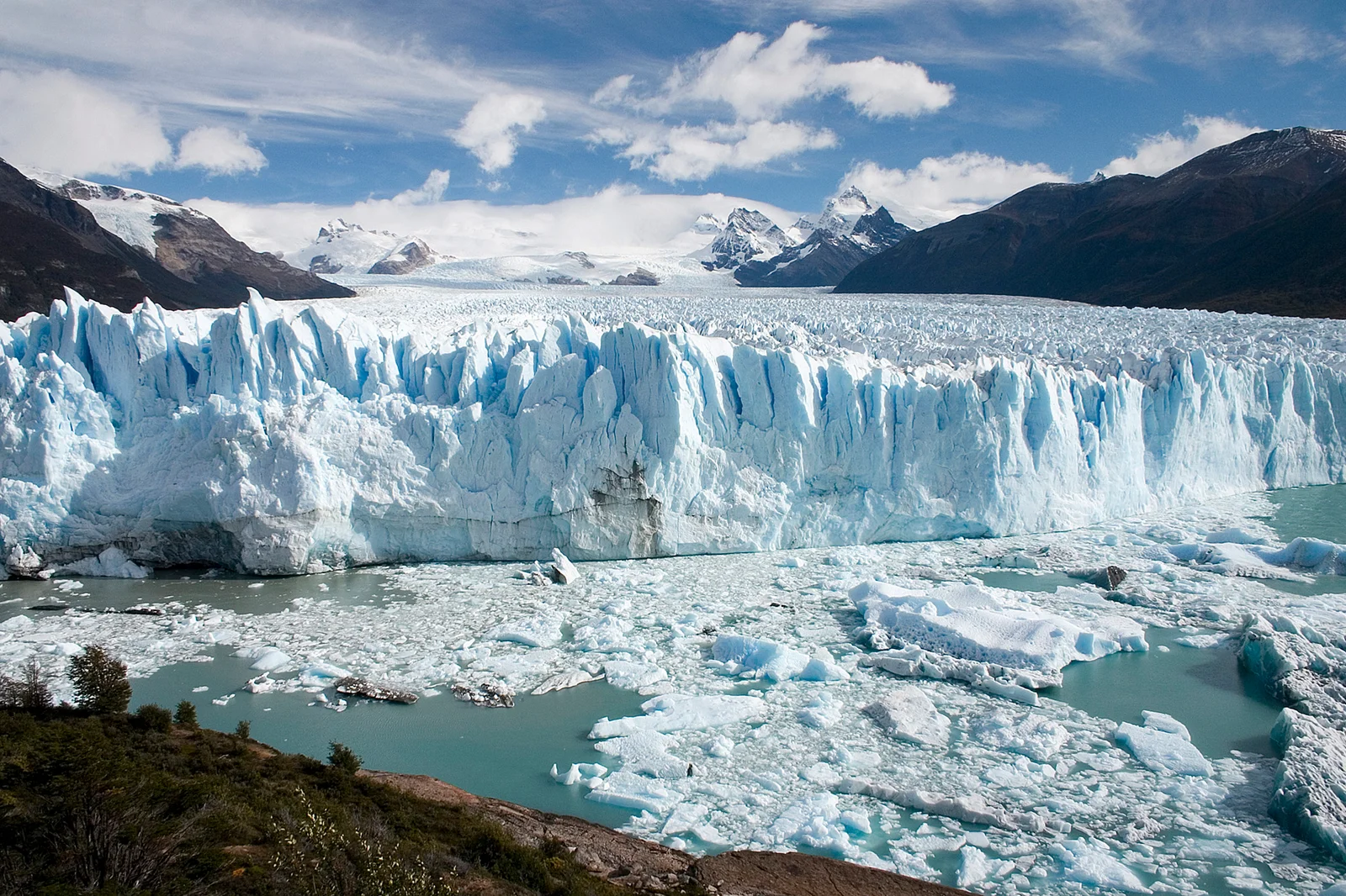 The blue-white ice cliffs of the Perito Moreno Glacier meeting Lake Argentino in Patagonia