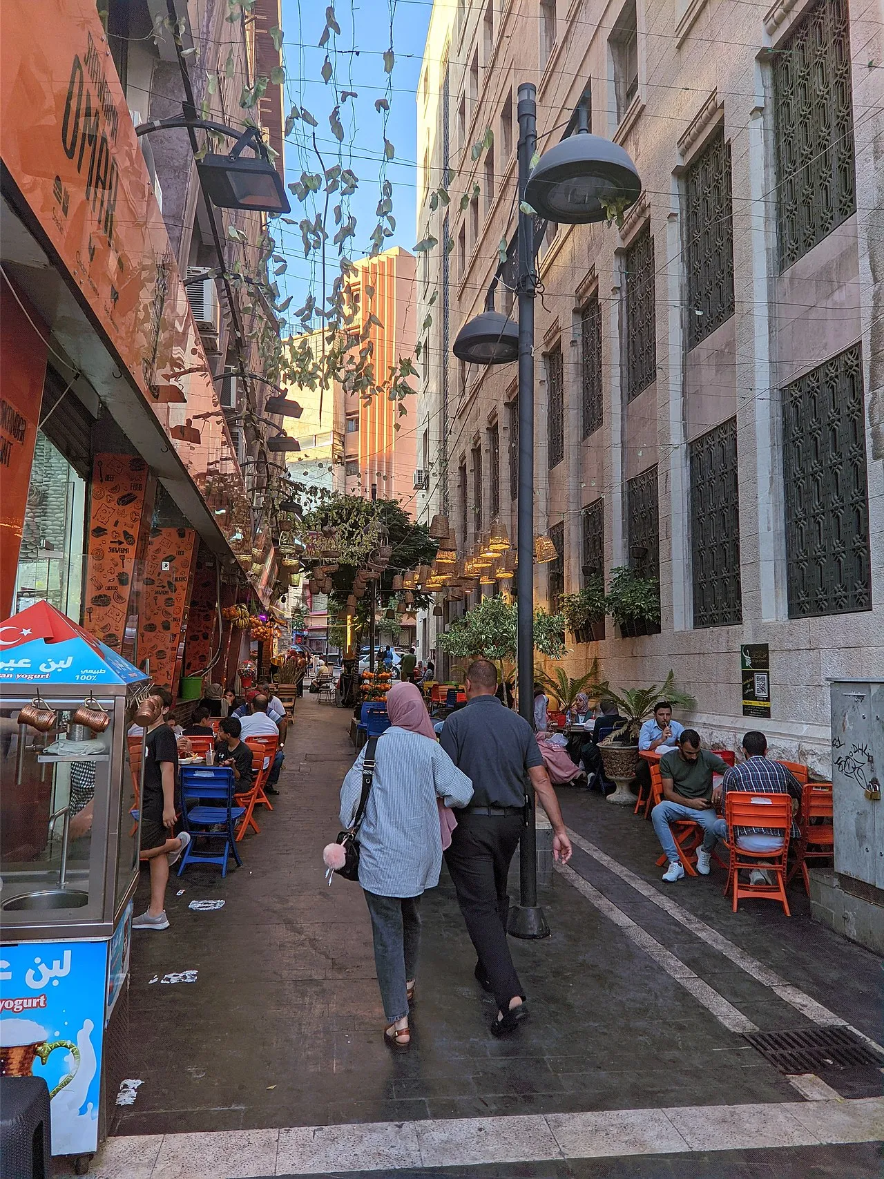 Downtown Amman street scene showing traditional shops and pedestrians in Al-Balad district