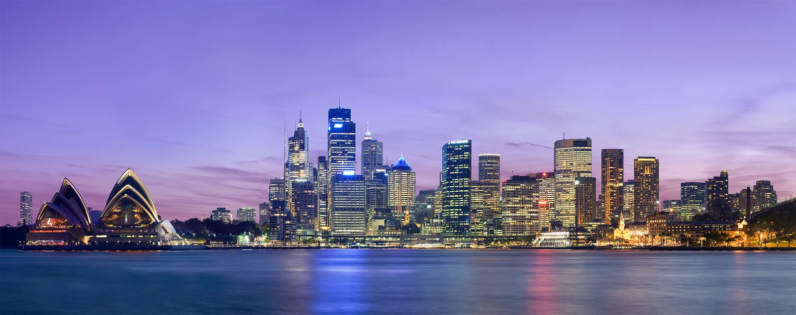 Sydney city skyline and harbour at dusk