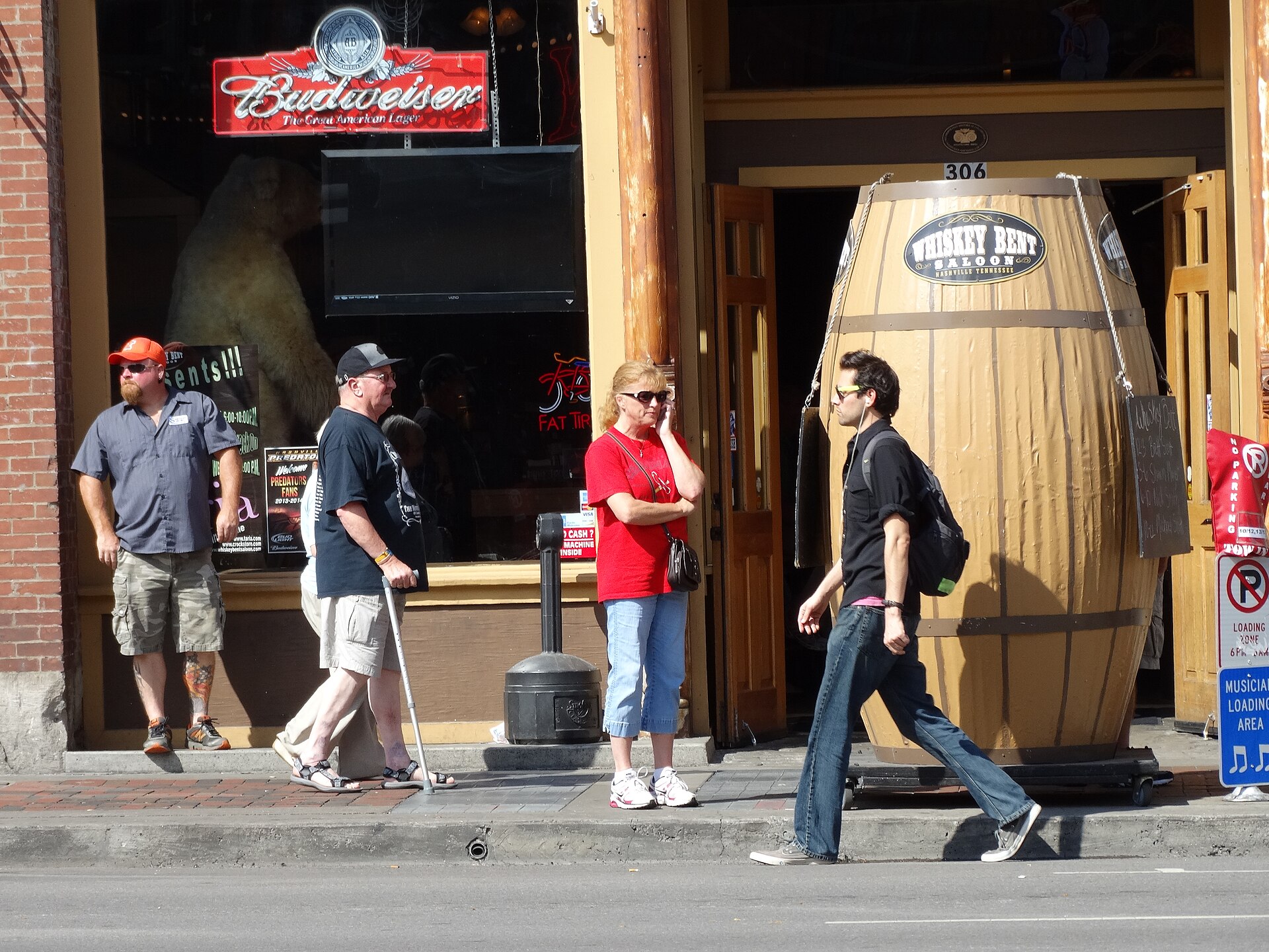 Broadway street scene with honky-tonk bars and neon signs in Nashville