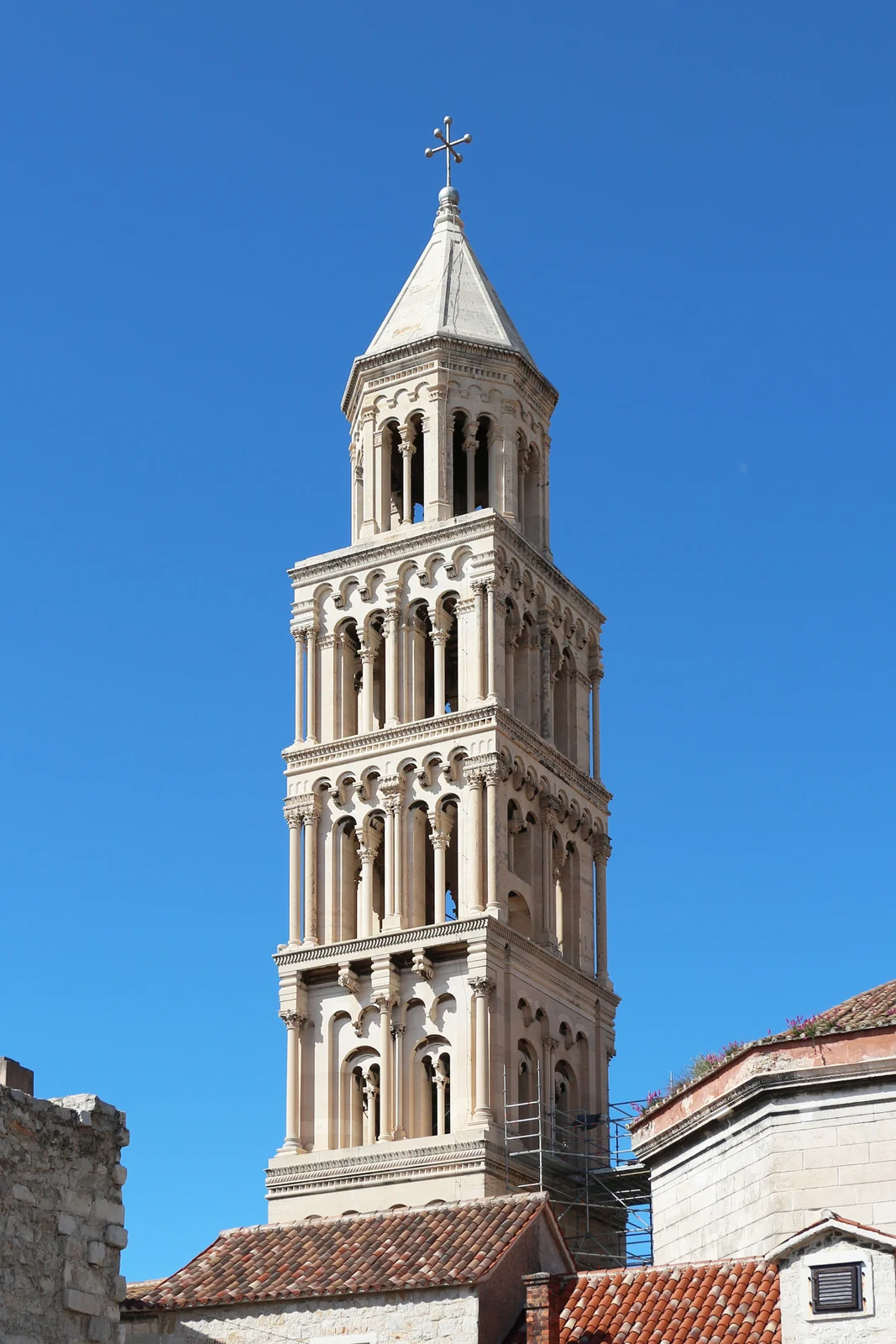 The tall Romanesque stone bell tower of the Cathedral of Saint Domnius rising against the sky in Split