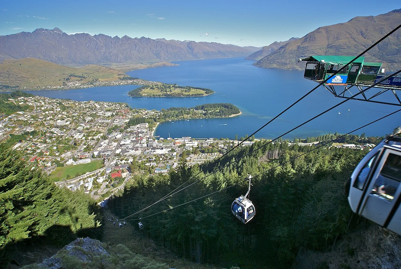 Queenstown Skyline Gondola cable car above the town with Lake Wakatipu and the Remarkables behind