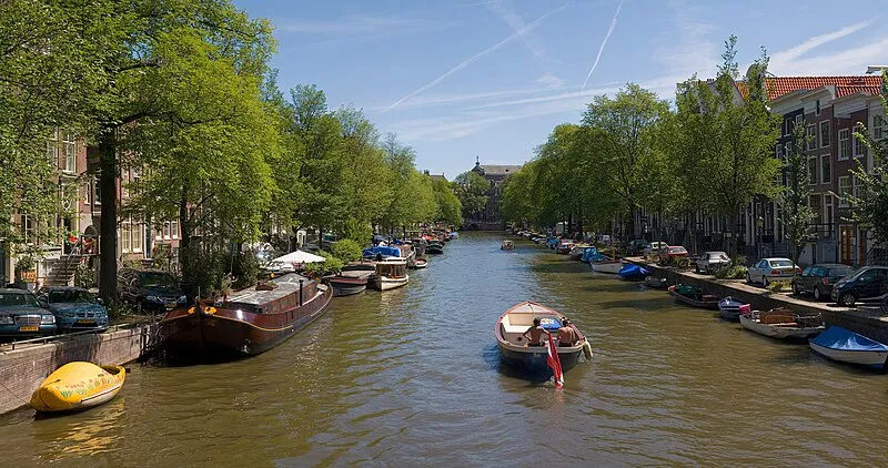 Amsterdam canal ring with historic gabled houses at dusk