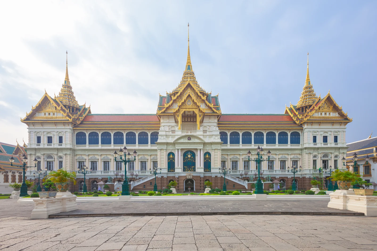 The Chakri Maha Prasat throne hall at the Grand Palace, an Italianate stone body under three Thai tiered-and-spired roofs