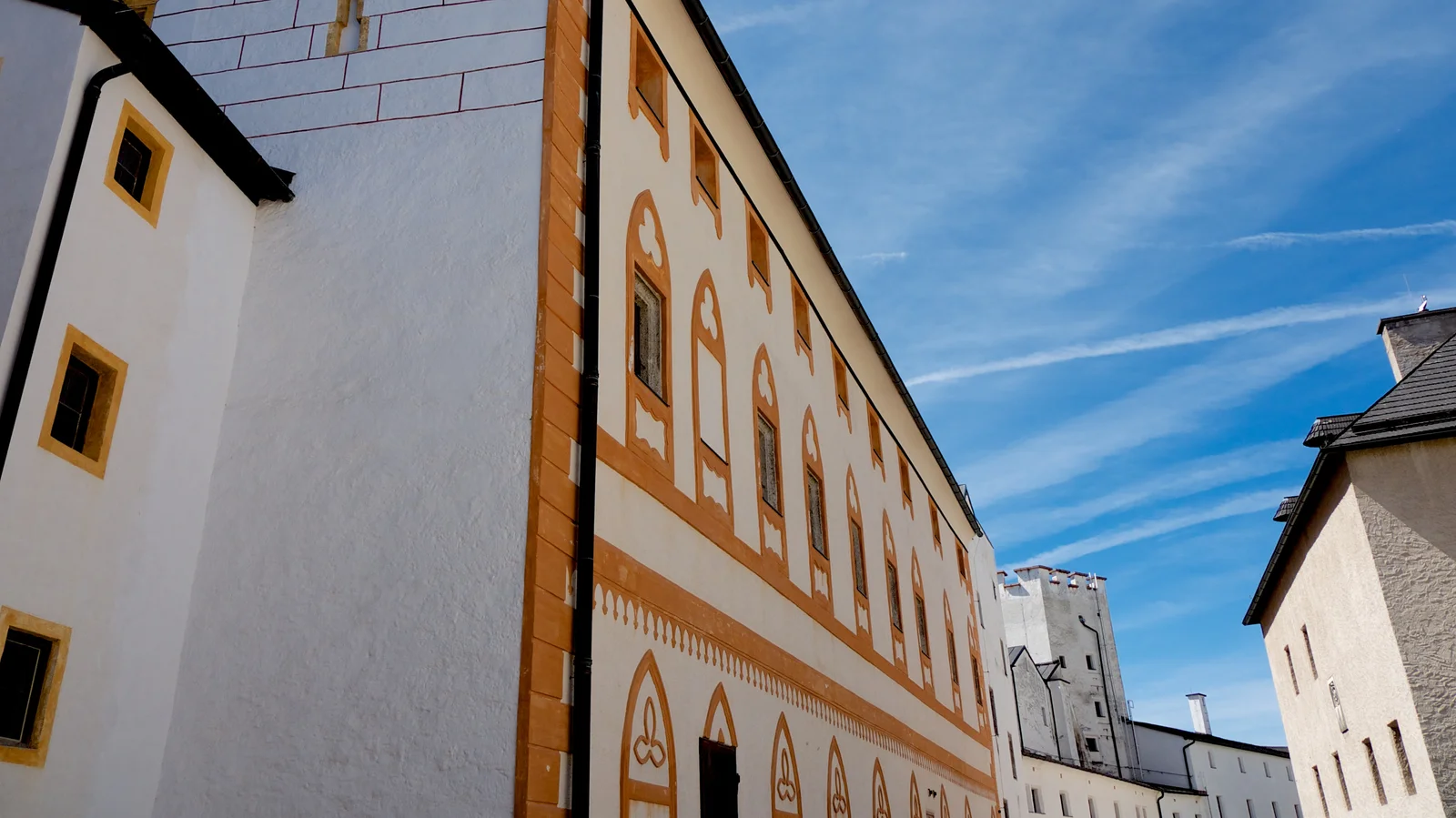 The whitewashed inner courtyard and towers of Hohensalzburg Fortress seen from within the ramparts