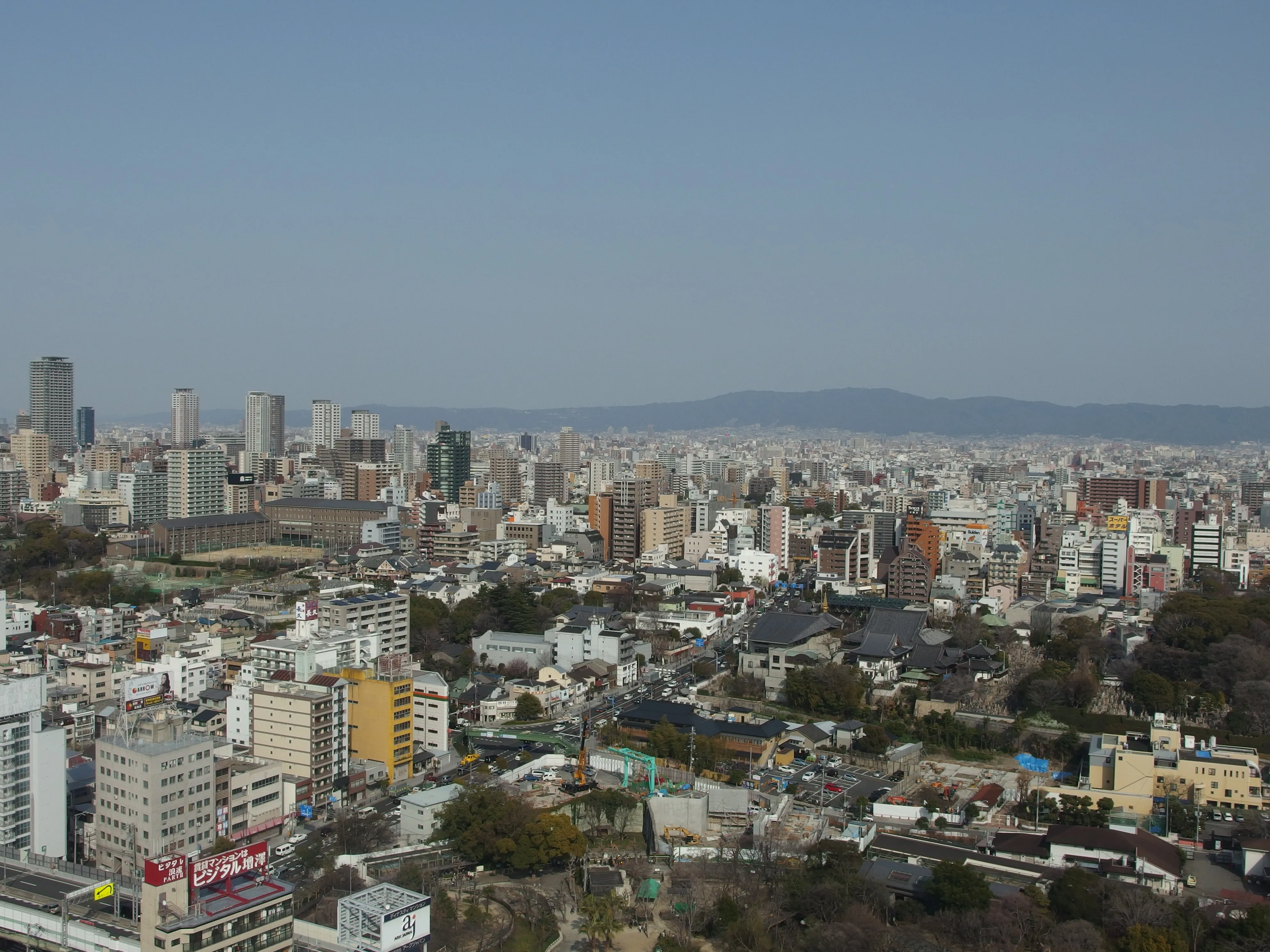 Tsutenkaku Tower rising above the retro neon signs of the Shinsekai district in Osaka