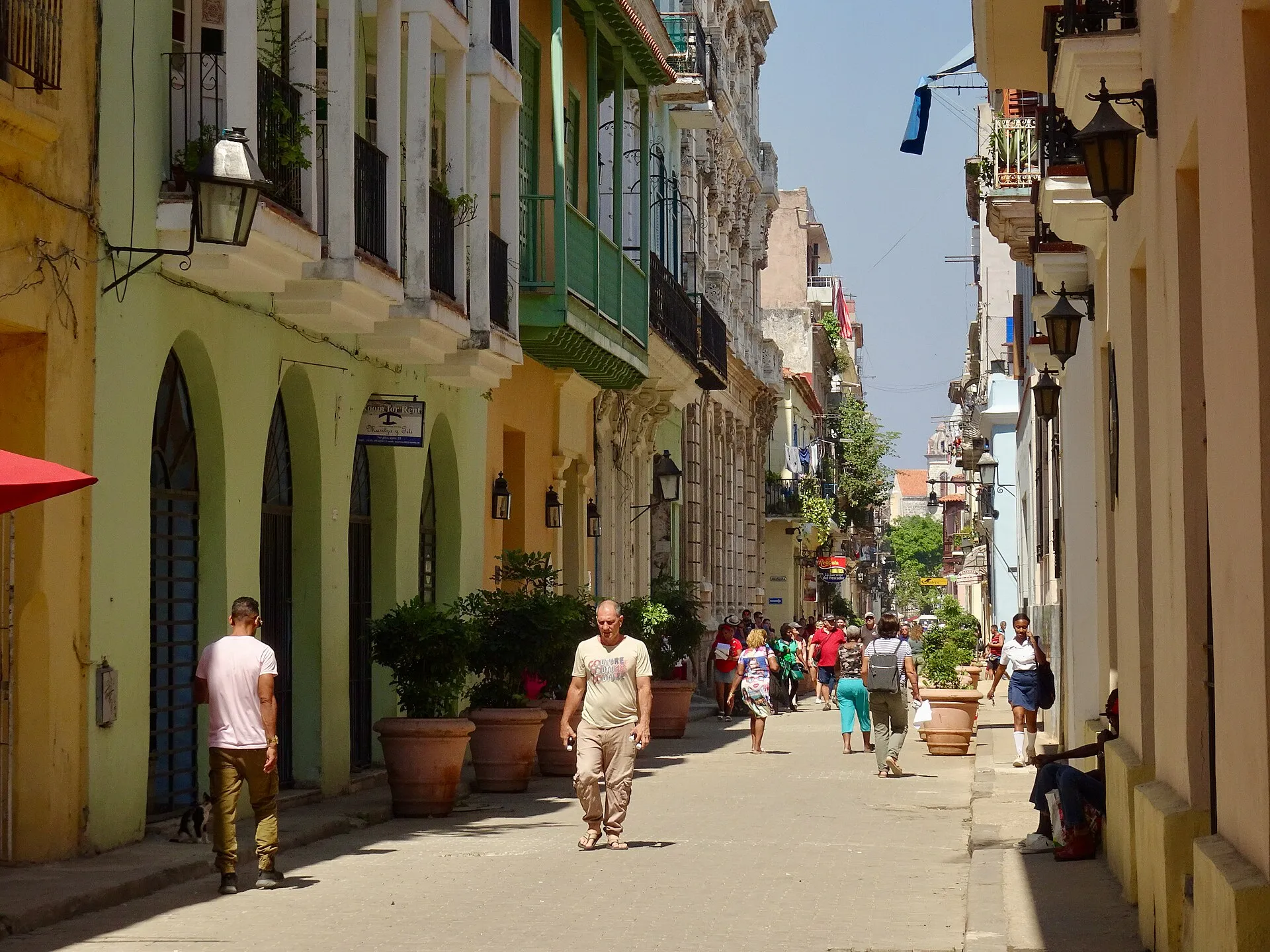 Street scene in Havana Cuba showing colonial architecture and a classic American car