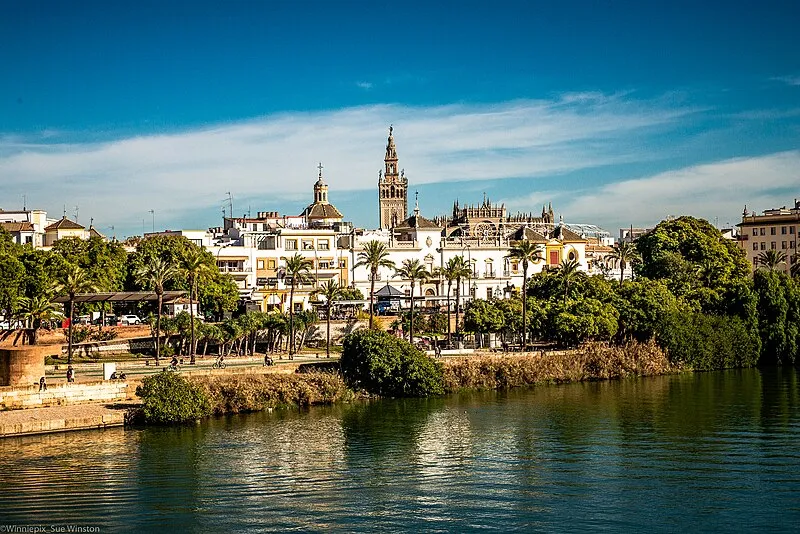 Seville skyline at sunset with the Giralda bell tower and cathedral