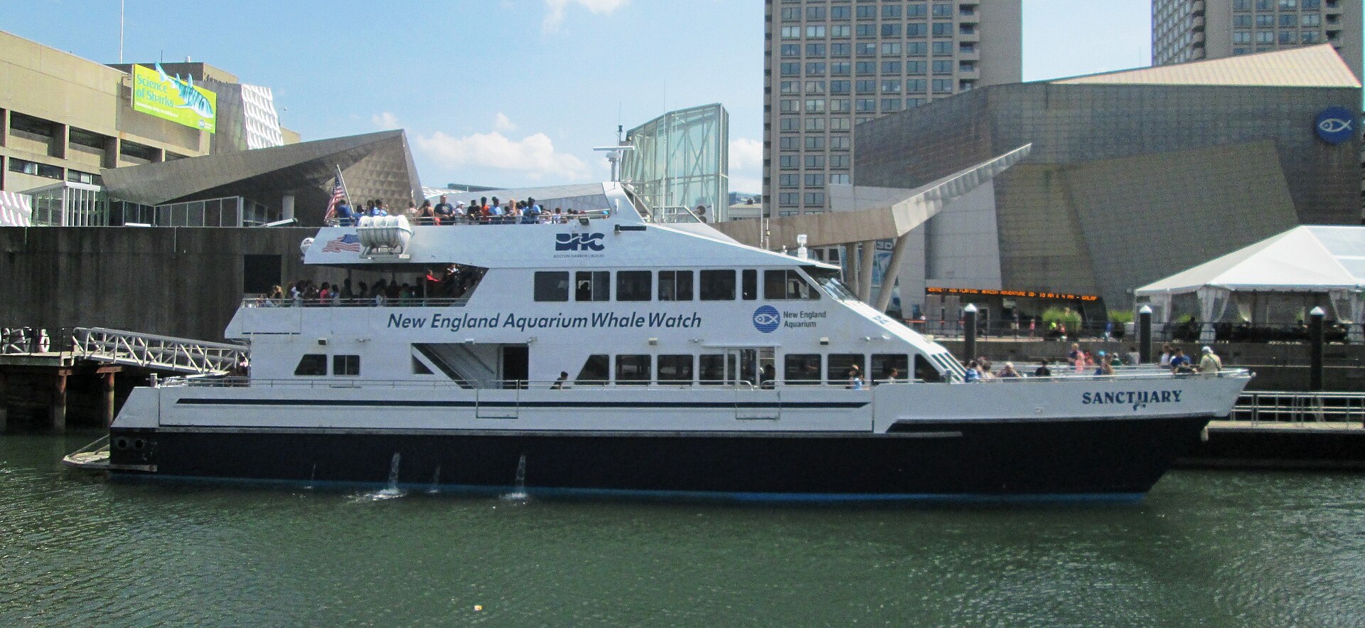 The New England Aquarium on Central Wharf in Boston with whale watch boat