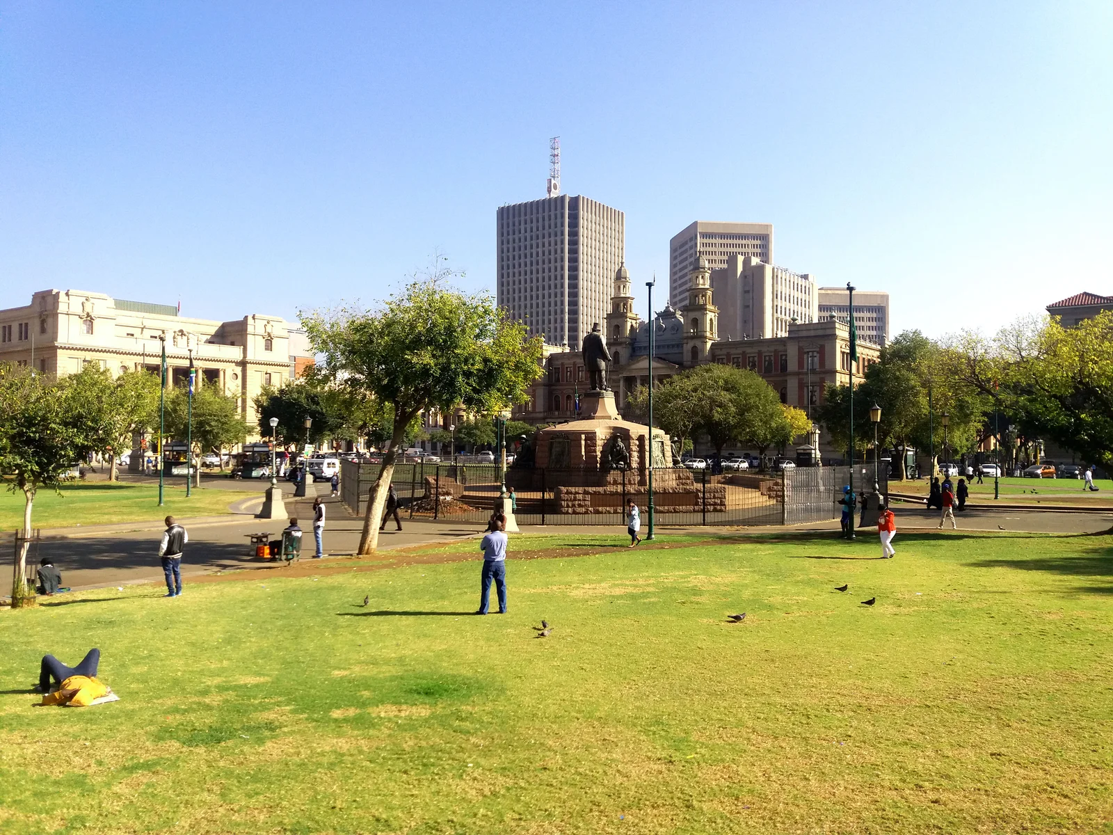 Church Square in central Pretoria, a grassy public square with a bronze statue of Paul Kruger at its centre and buildings behind