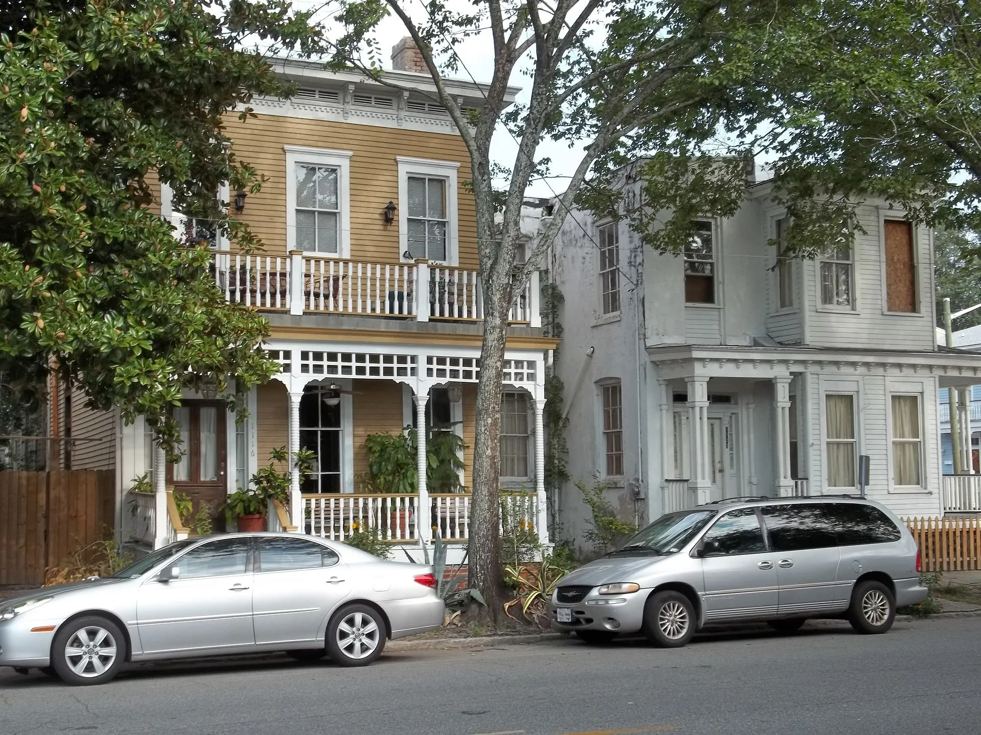 A historic square in Savannah's Victorian District with live oaks and period architecture