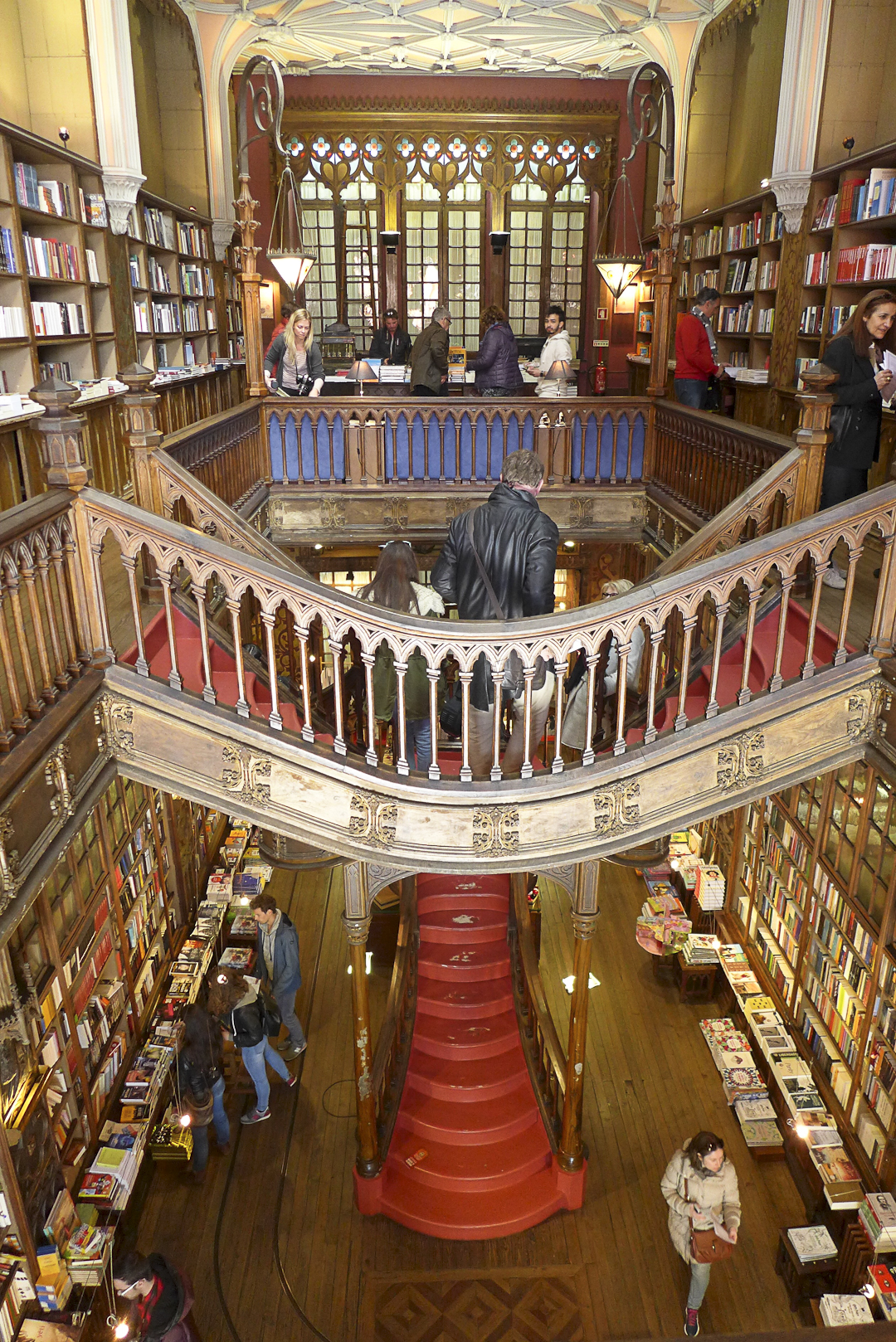 Interior of Livraria Lello bookshop in Porto showing the iconic crimson staircase