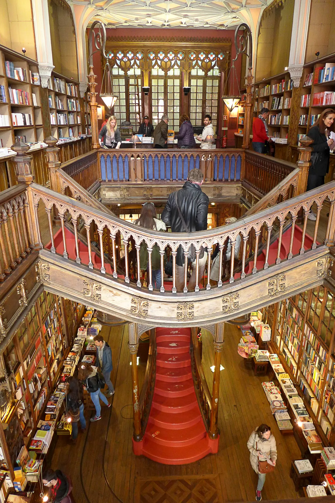 Interior of Livraria Lello bookshop in Porto showing the iconic crimson staircase