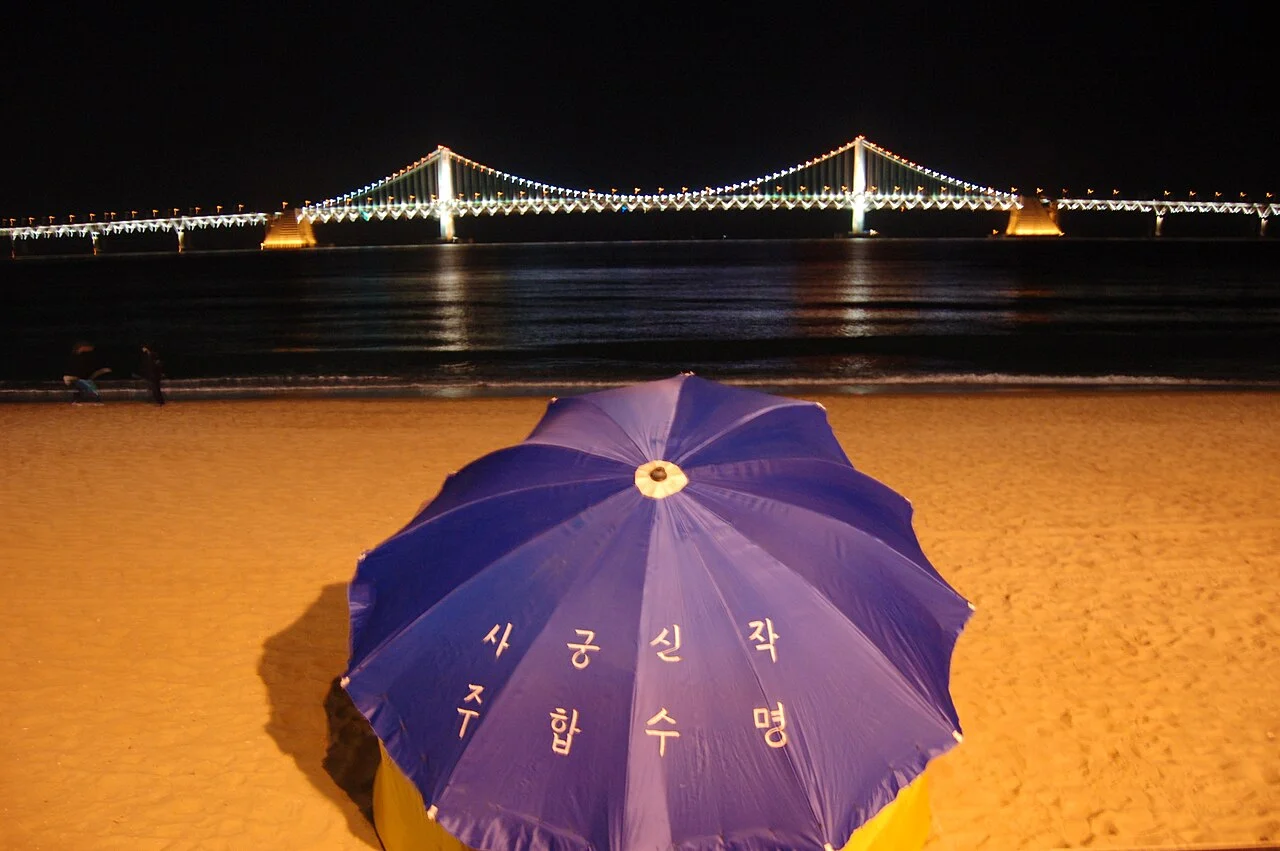 Gwangan suspension bridge illuminated at night over Gwangalli Beach in Busan, South Korea