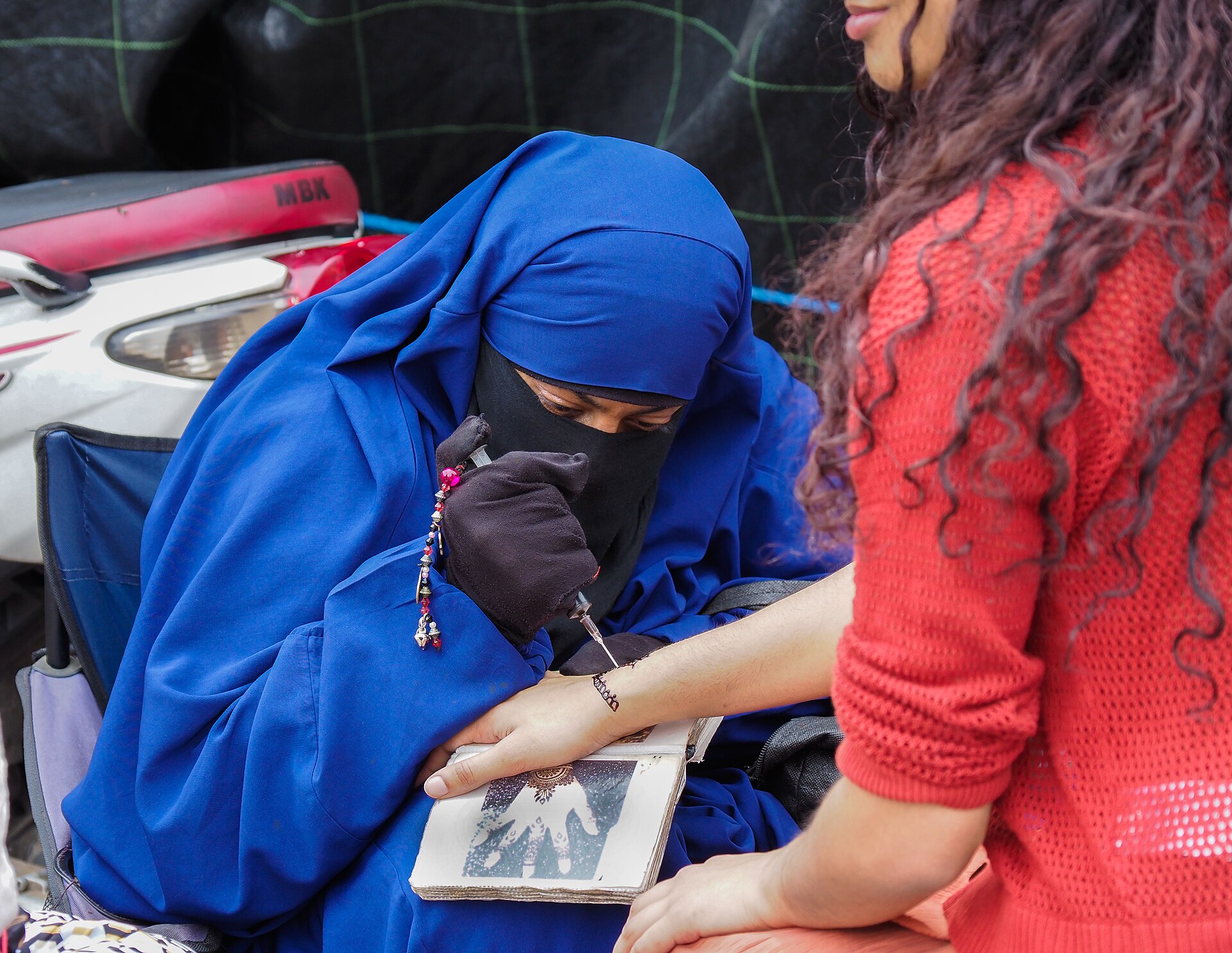 Jemaa el-Fnaa square in Marrakech at dusk with food stalls and crowds