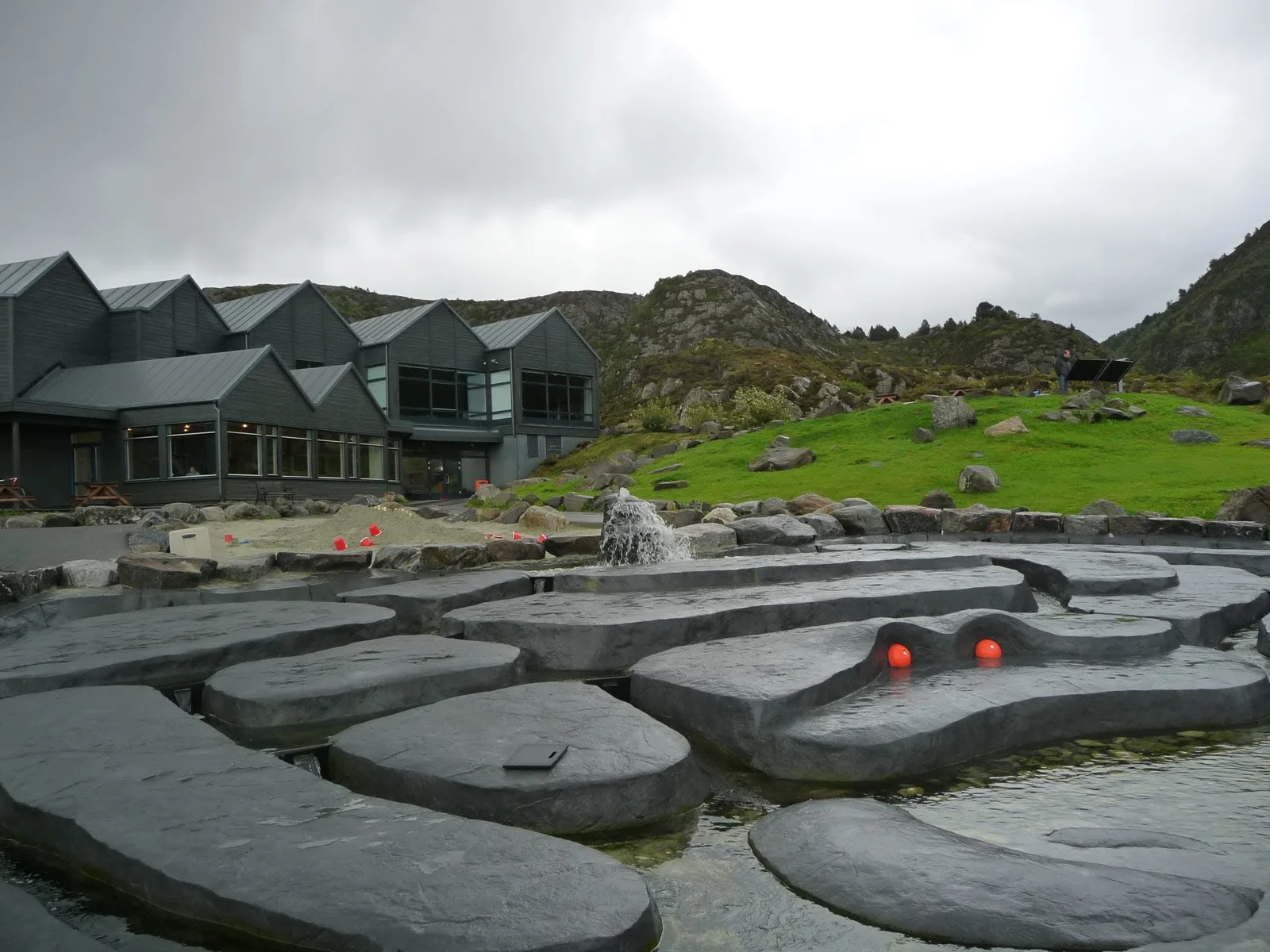 The coastal buildings of the Atlantic Sea Park aquarium on the shore near Ålesund