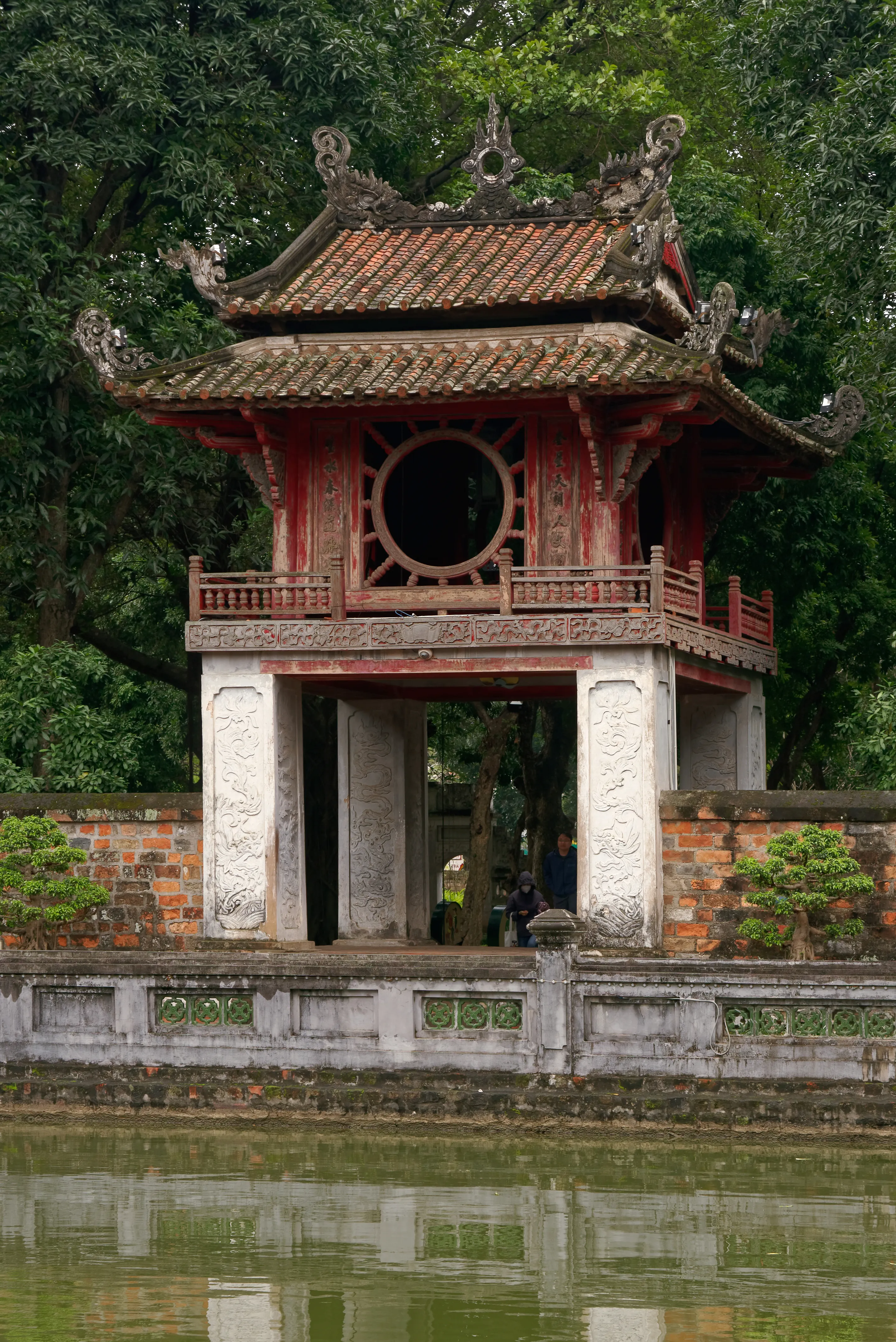 The Great Gate of the Temple of Literature in Hanoi, Vietnam, with traditional Vietnamese architecture and manicured gardens