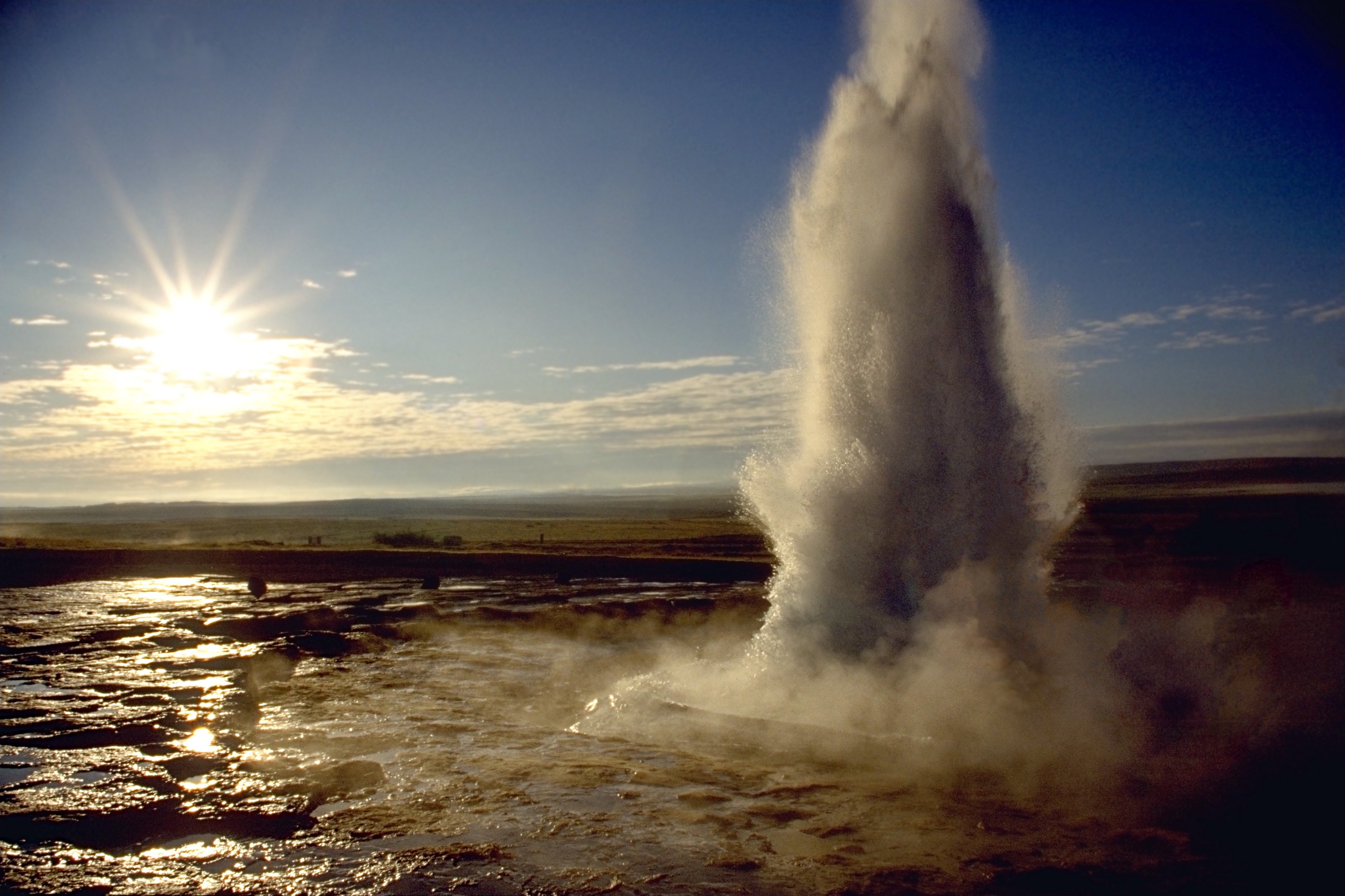 Strokkur geyser erupting in Iceland's Golden Circle, shooting boiling water high into the sky
