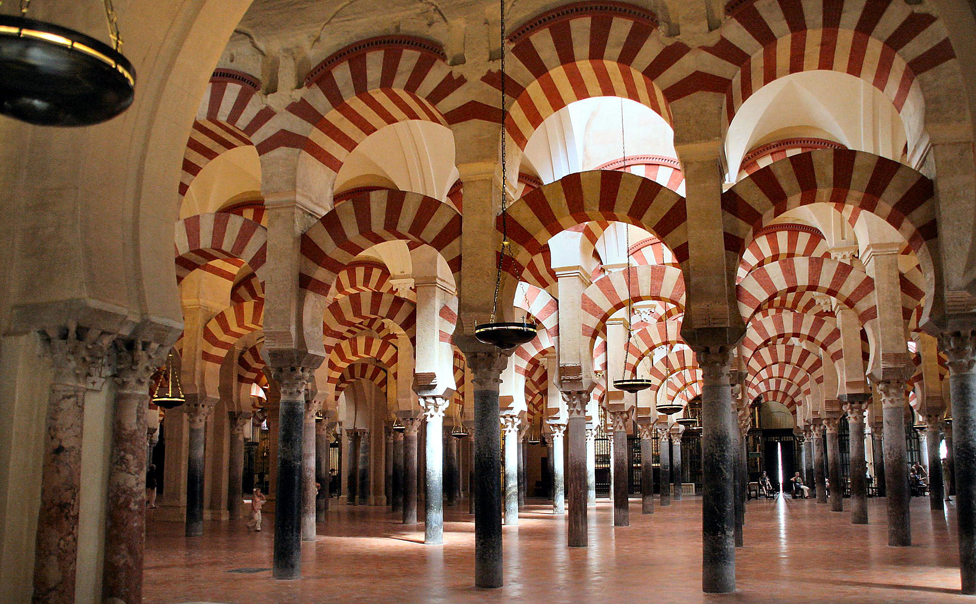 Interior of the Mezquita-Cathedral with its iconic red and white arches
