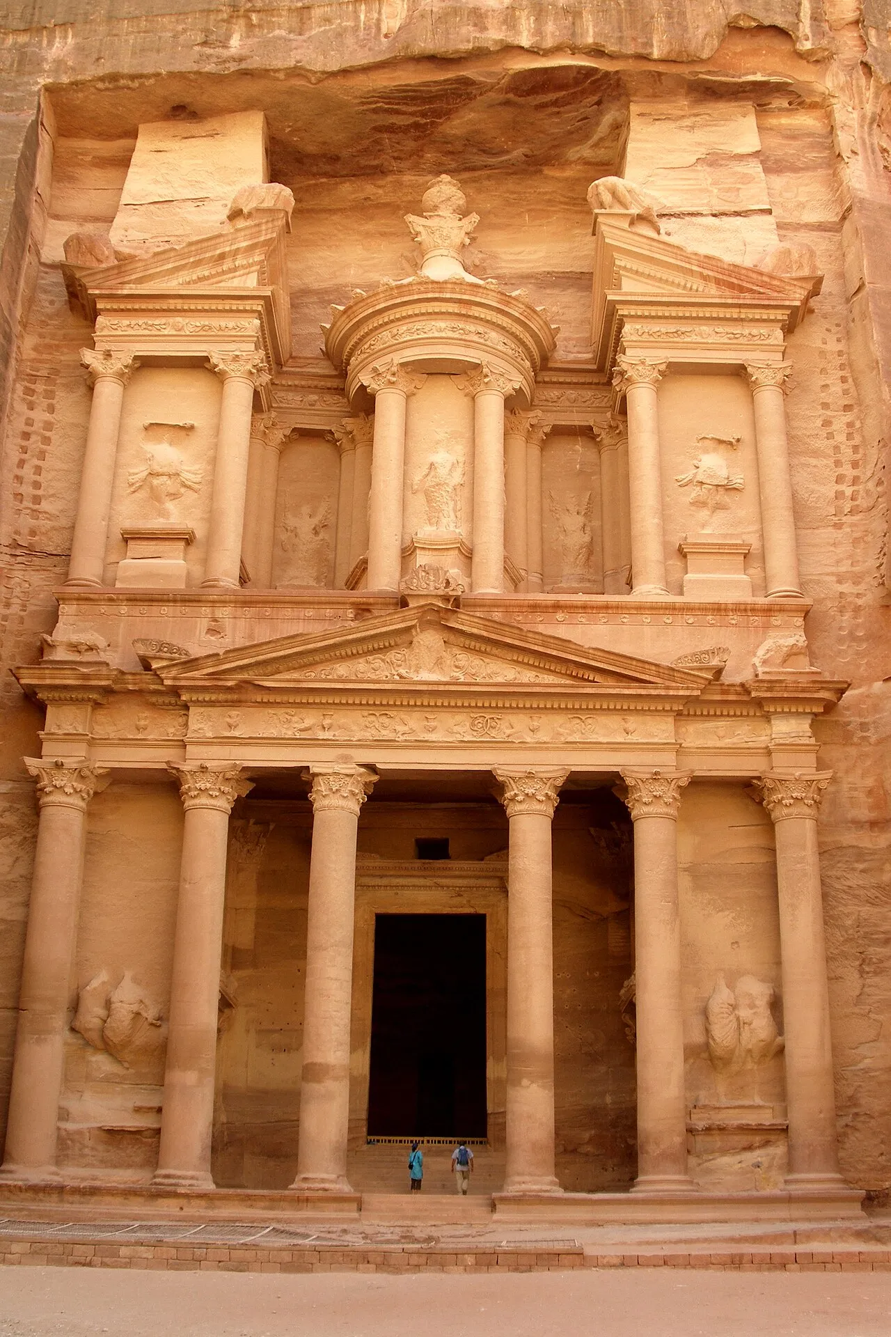 The Treasury (Al-Khazneh) facade carved into rose-red sandstone at Petra, Jordan