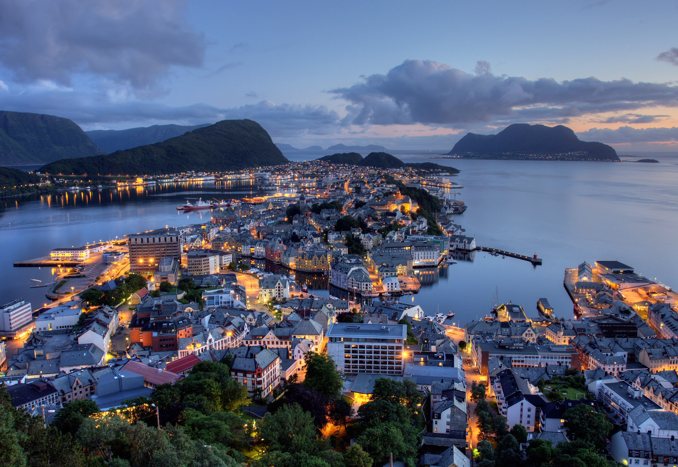 Ålesund art nouveau city at night, Norway, with its waterfront buildings and island setting