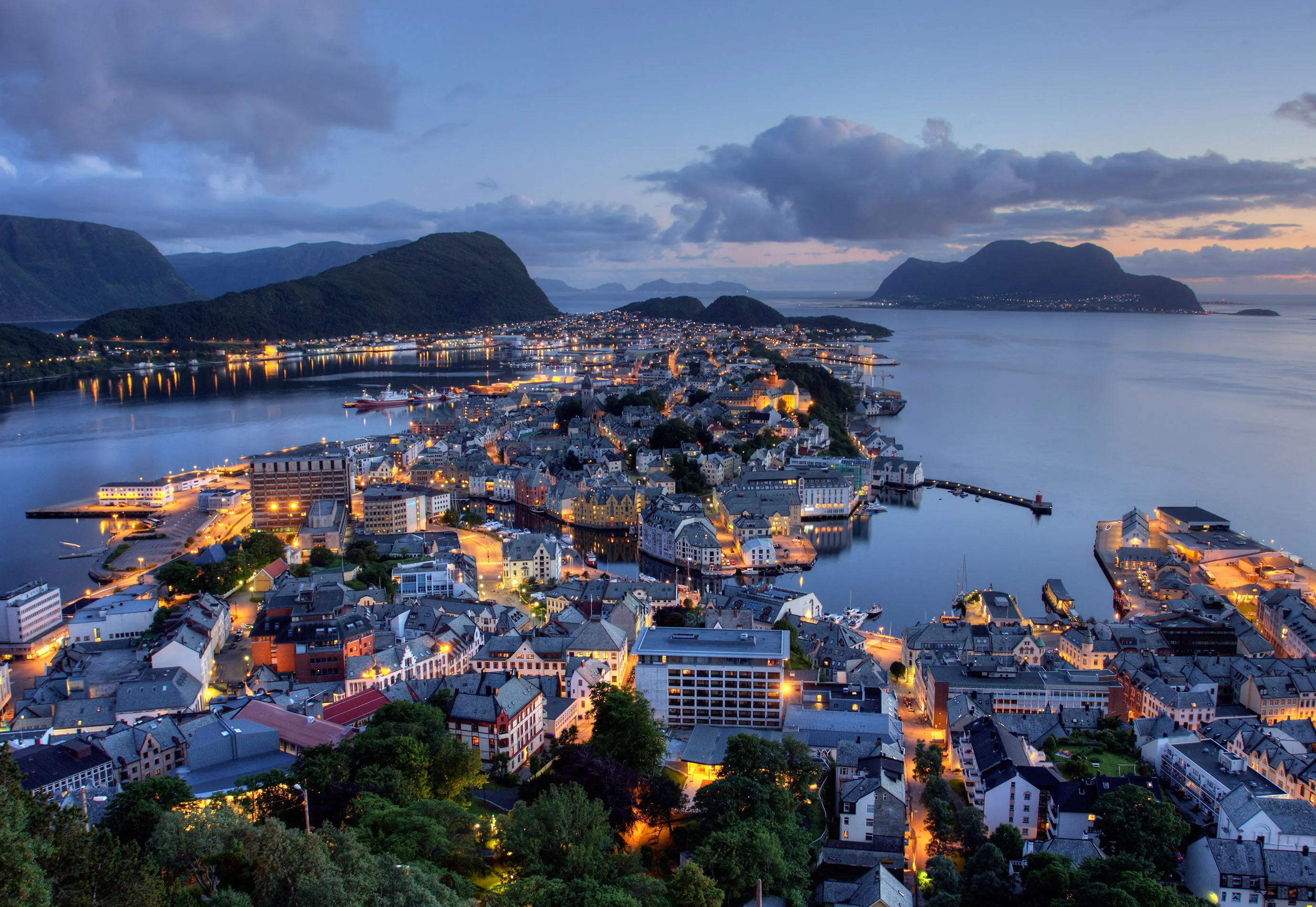 Ålesund art nouveau city at night, Norway, with its waterfront buildings and island setting