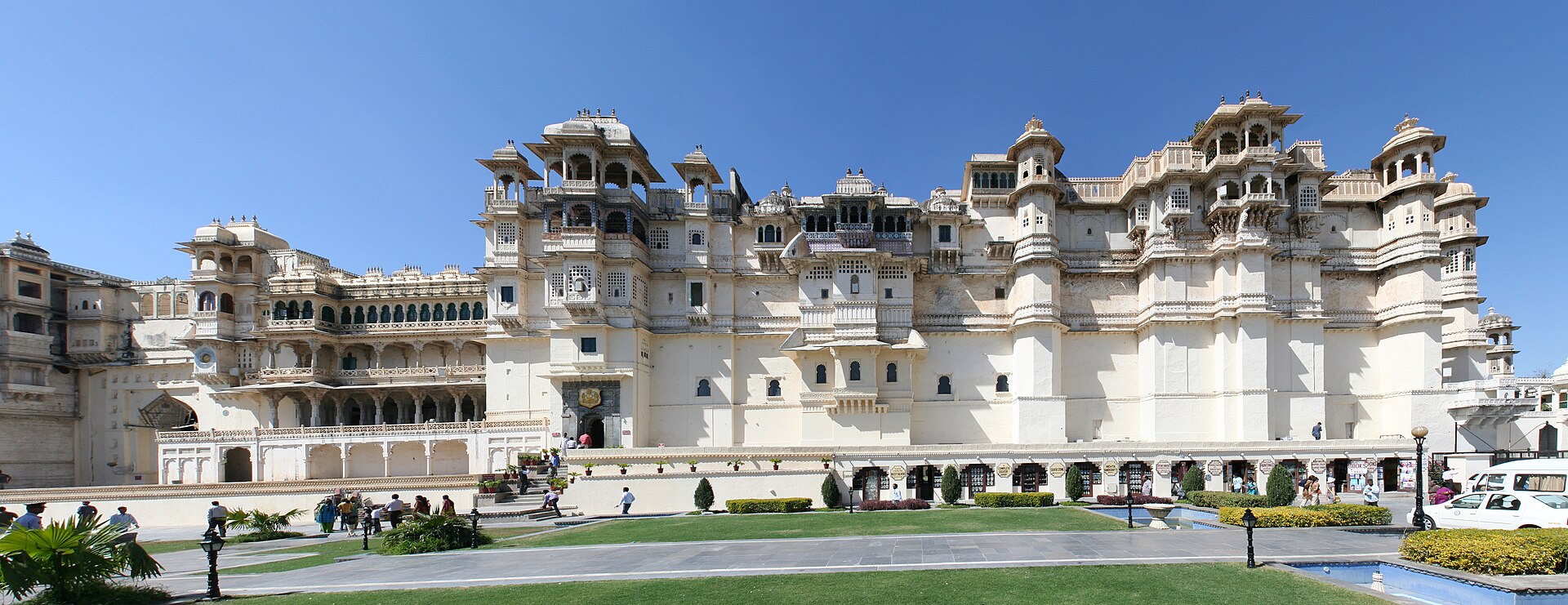 Panoramic view of the City Palace facade in Udaipur from across the courtyard