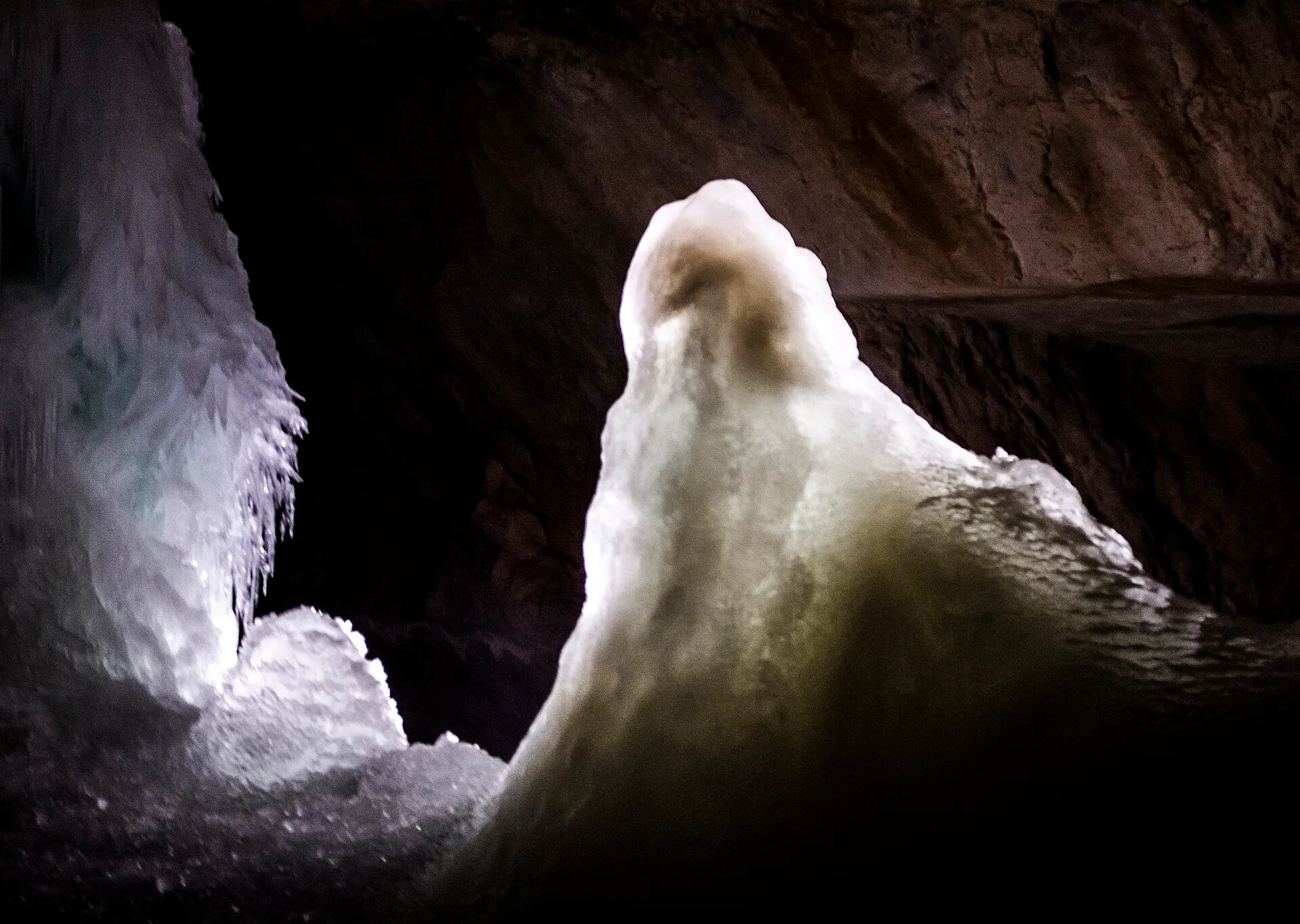 Illuminated ice formation inside the Dachstein ice cave