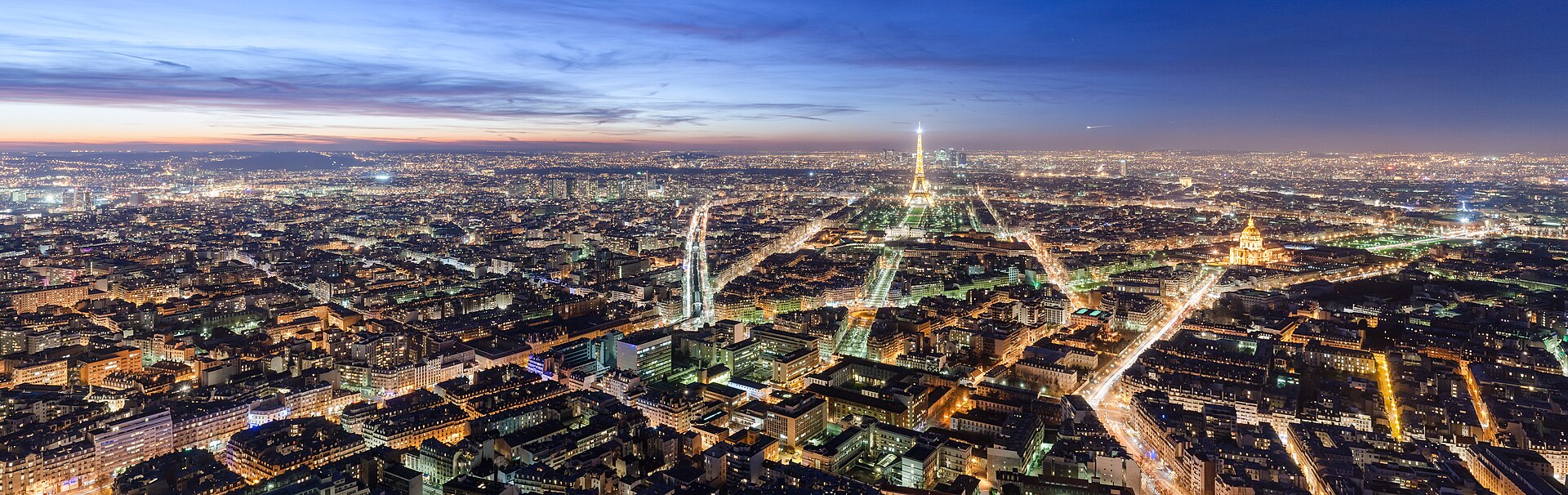Panoramic night view of the Paris skyline with illuminated landmarks
