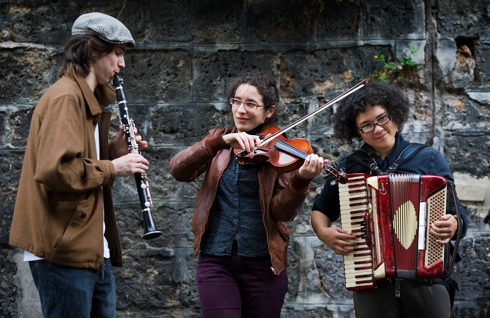 Street musicians performing on a Montmartre street in Paris