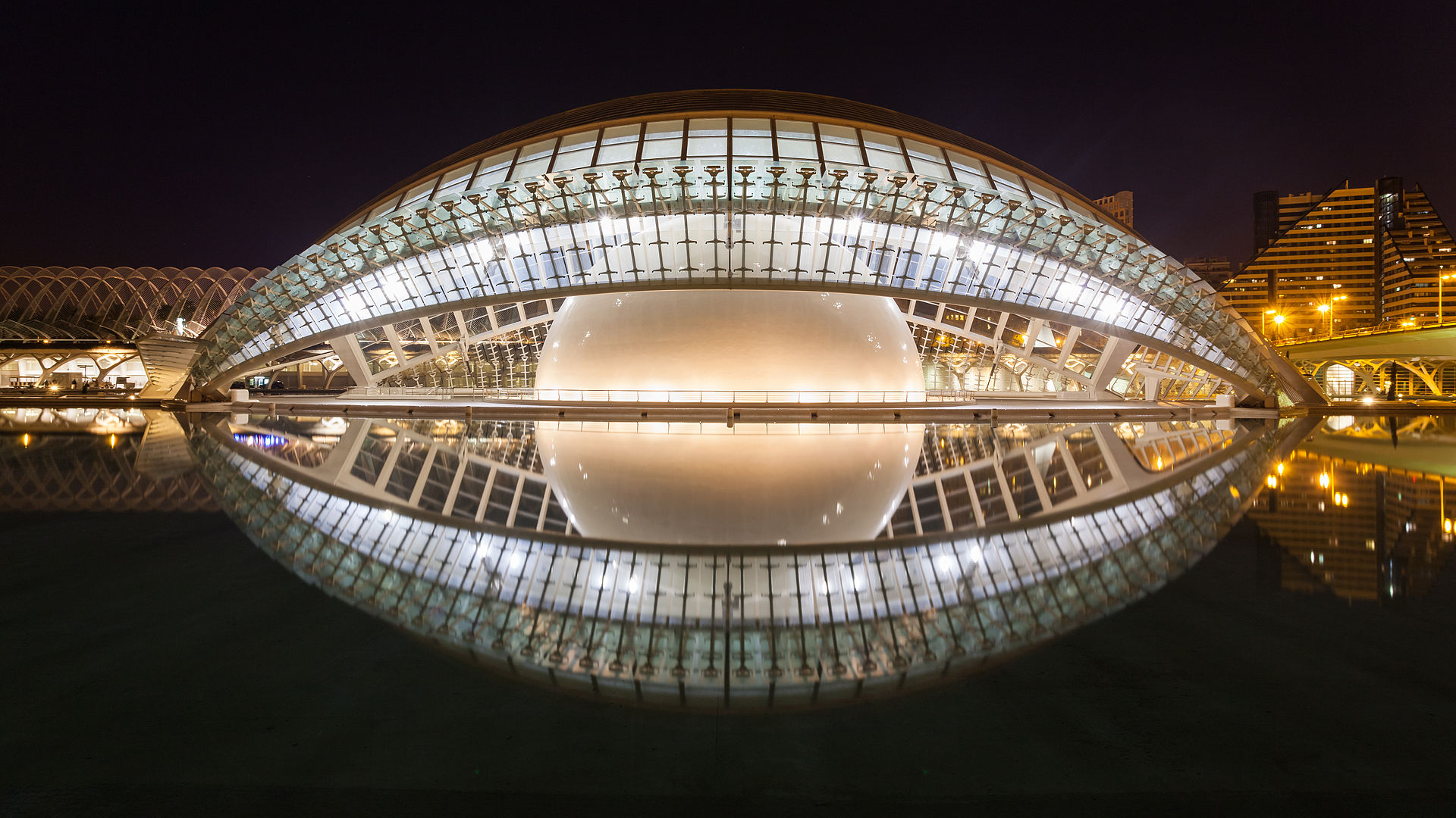 City of Arts and Sciences complex reflected in water at dusk in Valencia