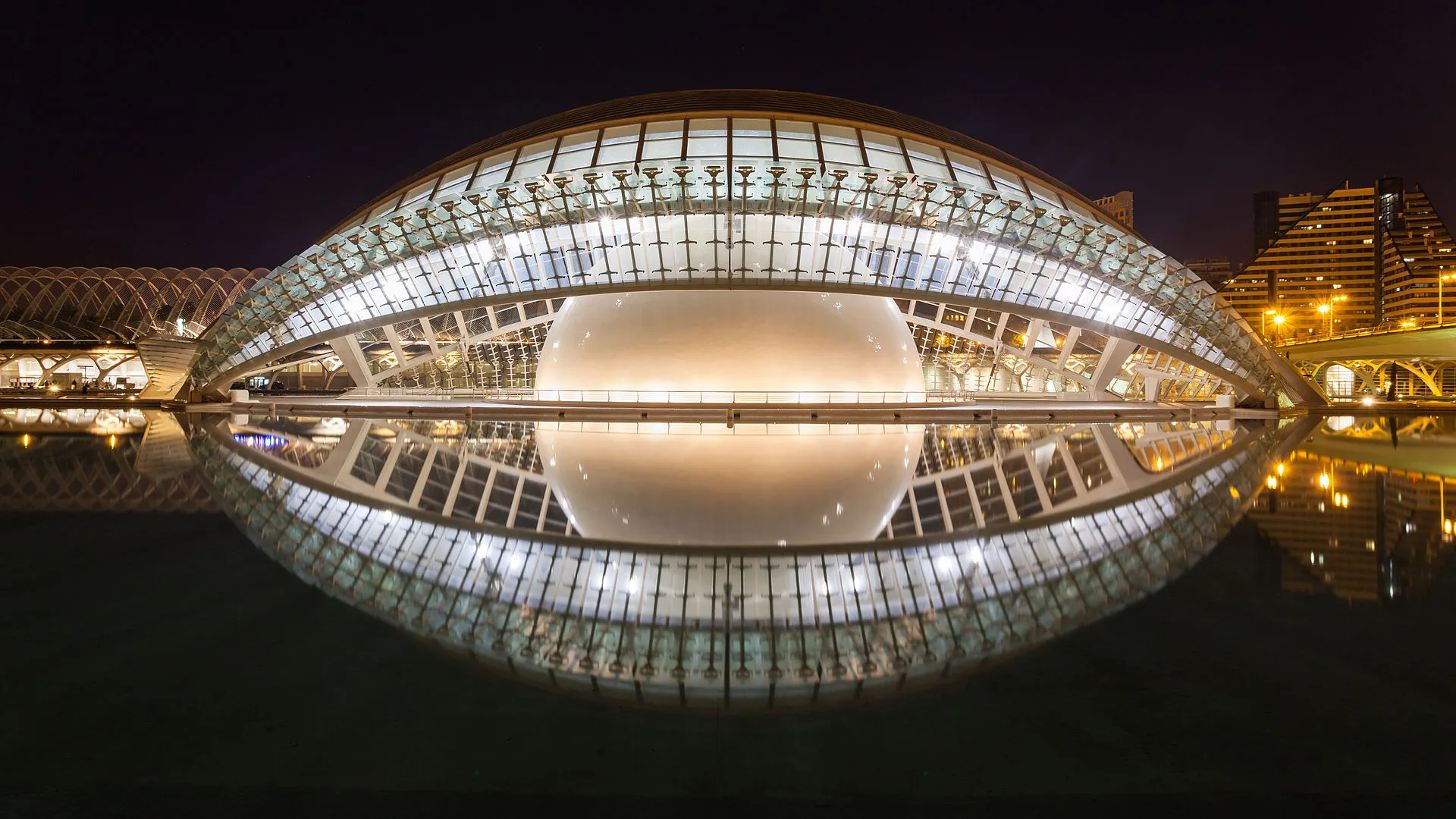 City of Arts and Sciences complex reflected in water at dusk in Valencia