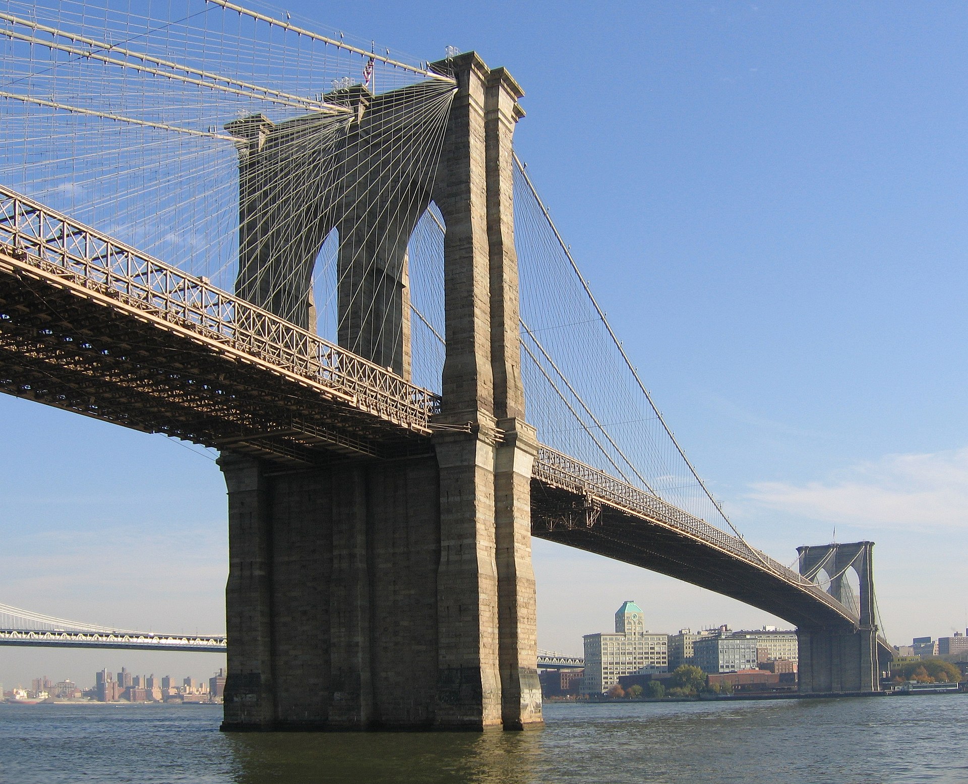 The Brooklyn Bridge with its Gothic arches and suspension cables spanning the East River